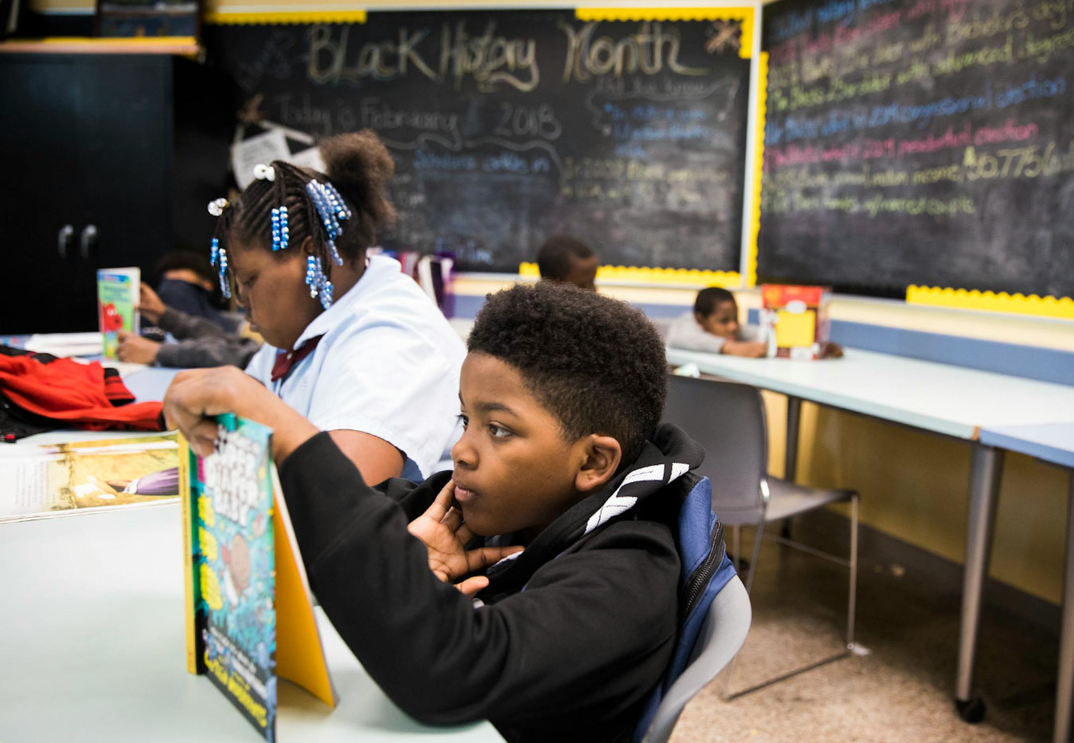 Rekhori Davis, 8, reads a book during after school programing.