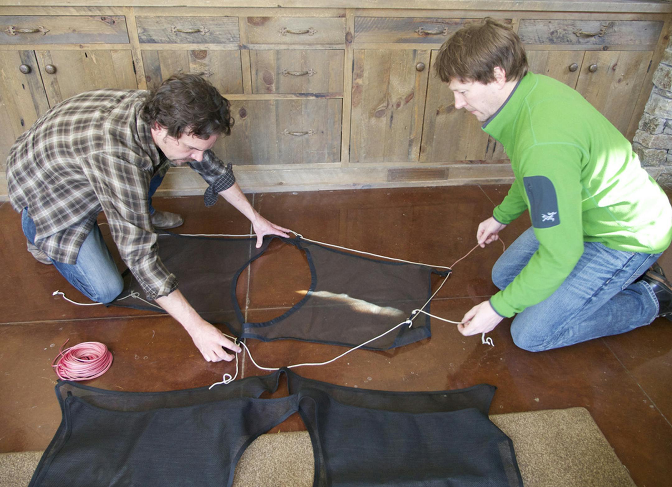 University of Minnesota associate professor Aaron Doering and Centennial High geography teacher Chris Ripken prep dryhing rack to hang inside their tents during their Canadian arctic expedition.
