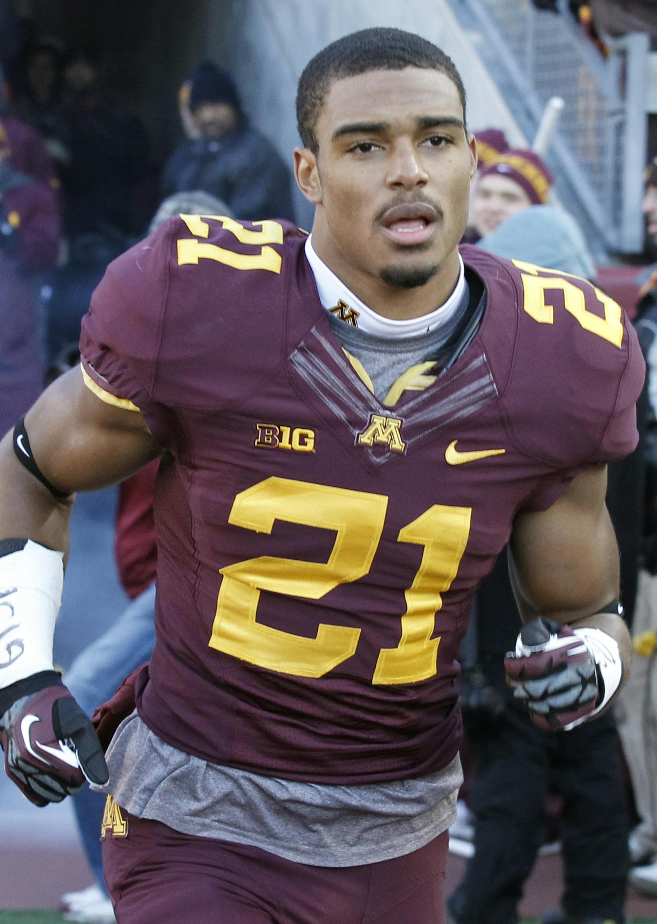 Minnesota defensive back Brock Vereen (21) takes the field prior to an NCAA college football game against Wisconsin in Minneapolis Saturday, Nov. 23, 2013. (AP Photo/Ann Heisenfelt) ORG XMIT: OTKAH113 AH10