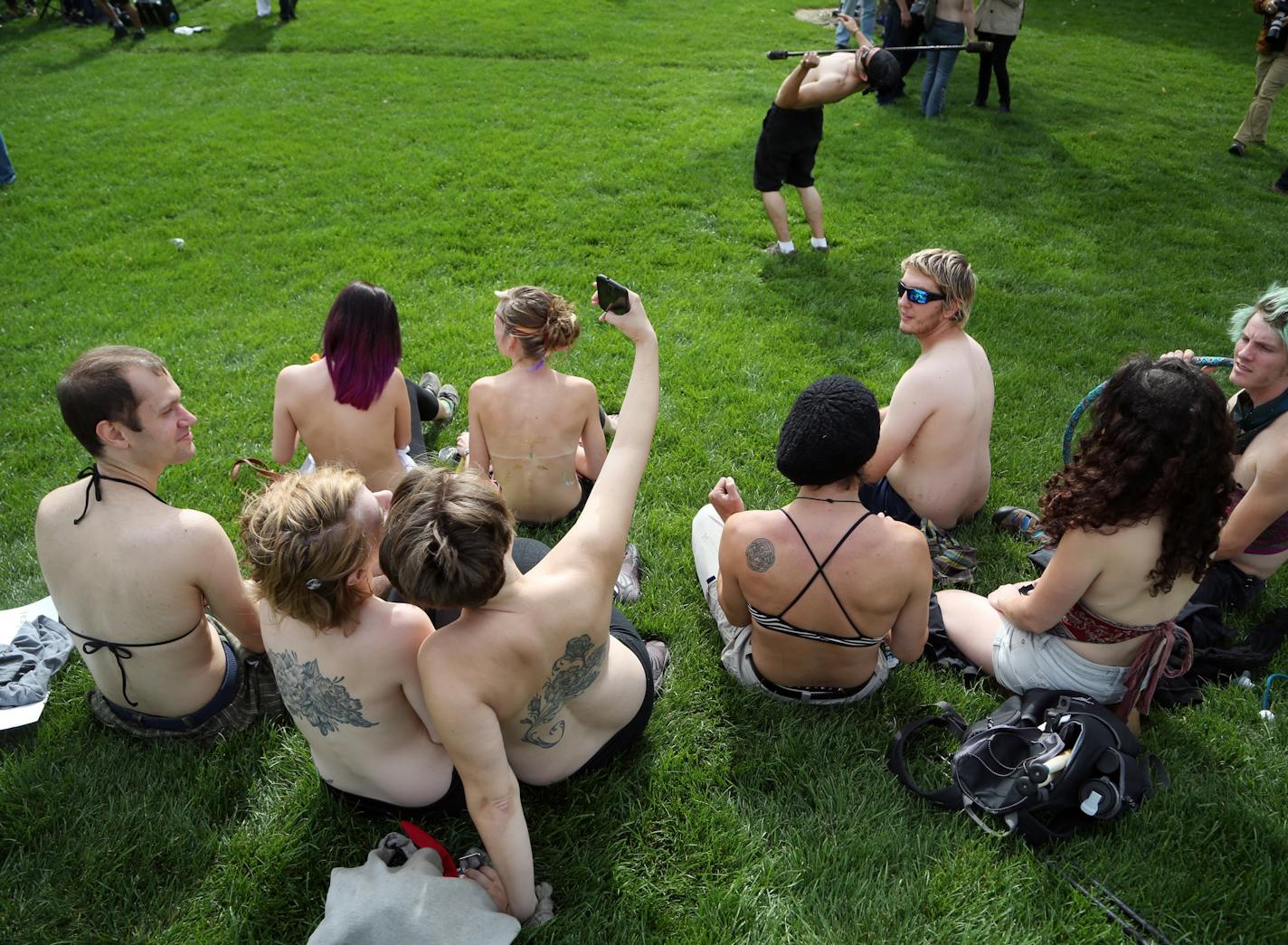 Saying it's a matter of gender equity and freedom of expression, topless demonstrators gathered at Gold Medal Park Sunday August 23, 2015 in Minneapolis, MN.