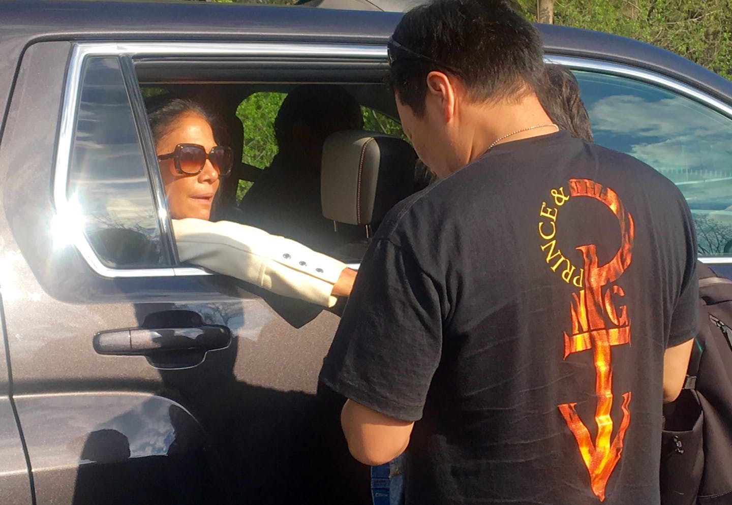 Former Prince drummer Sheila E consoles a fan as she left Paisley Park in Chanhassen, Minn., Saturday, April 23, 2016. The music superstar was pronounced dead at his Paisley Park estate near Minneapolis on Thursday. He was 57.