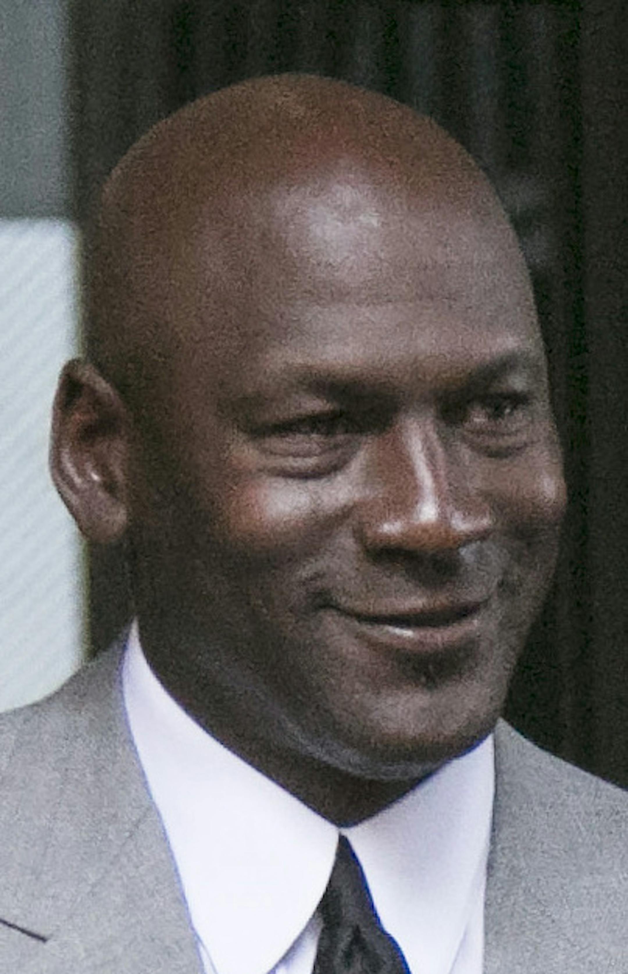 Michael Jordan leaves the U.S. courthouse Tuesday, Aug. 11, 2015, in Chicago. after the first day of his civil trial against the defunct grocery-store chain Dominick's Finer Foods for using his name and jersey number without permission. (Ashlee Rezin/Sun-Times Media via AP)