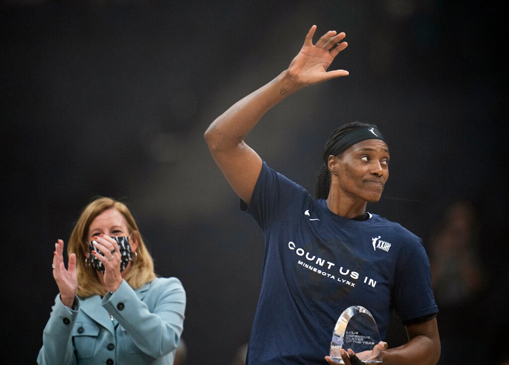 Minnesota Lynx center Sylvia Fowles waved to the crowd after WNBA commissioner Cathy Engelbert presented her with the fourth WNBA Defensive Player of the Year trophy of her career, the second-most by a player in WNBA history.