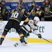 Wild left wing Kirill Kaprizov vies for the puck against Golden Knights center Nicolas Roy during the second period of Game 7