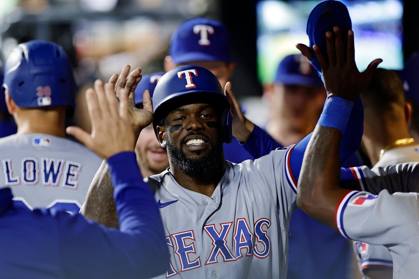 Texas Rangers' Adolis Garcia celebrates with teammates after against the New York Mets during the eighth inning of a baseball game Wednesday, Aug. 30, 2023, in New York. (AP Photo/Adam Hunger)