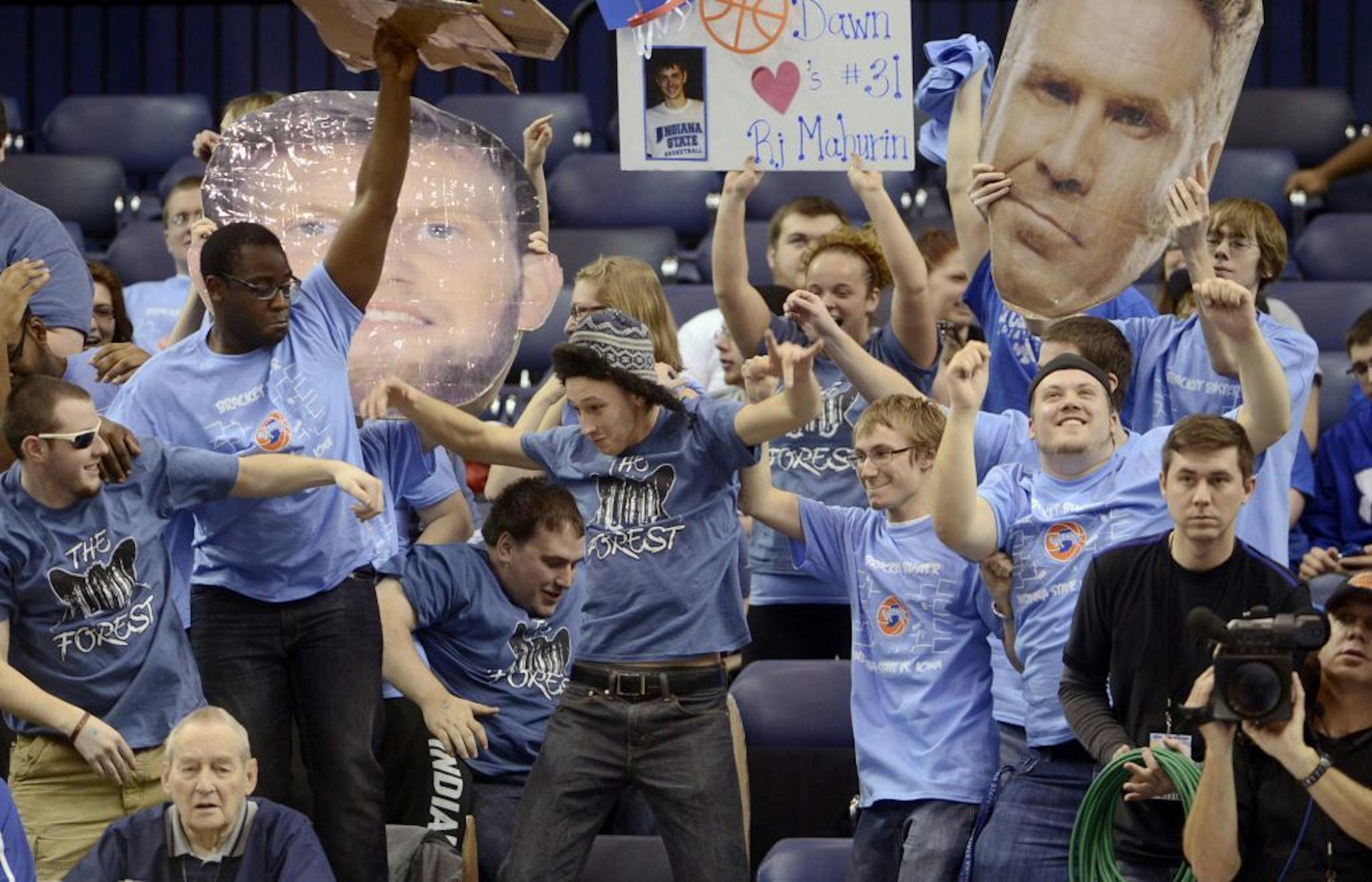 Indiana State University students dance the Harlem Shake, during a timeout in the Indiana State and Iona NCAA college basketball game Saturday, Feb. 23, 2013.