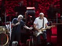 Lead singer Roger Daltrey with guitarist Pete Townshend during Amazing Journey early in The Who's show at Xcel Friday night.