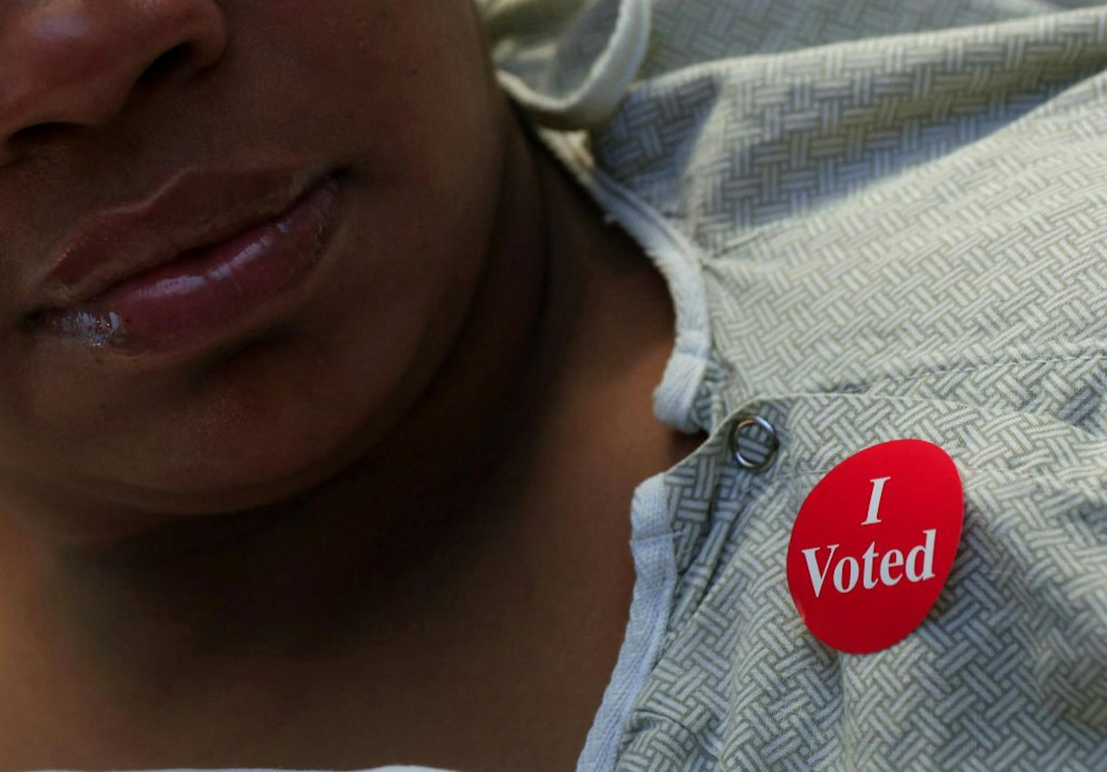 Lashelle Coleman of St. Paul is at Regions Hospital because of acute migrane headaches so she voted in her hospital bed. After she voted, Lashelle received her "I Voted" sticker. St. Paul, MN at on November 5, 2012.