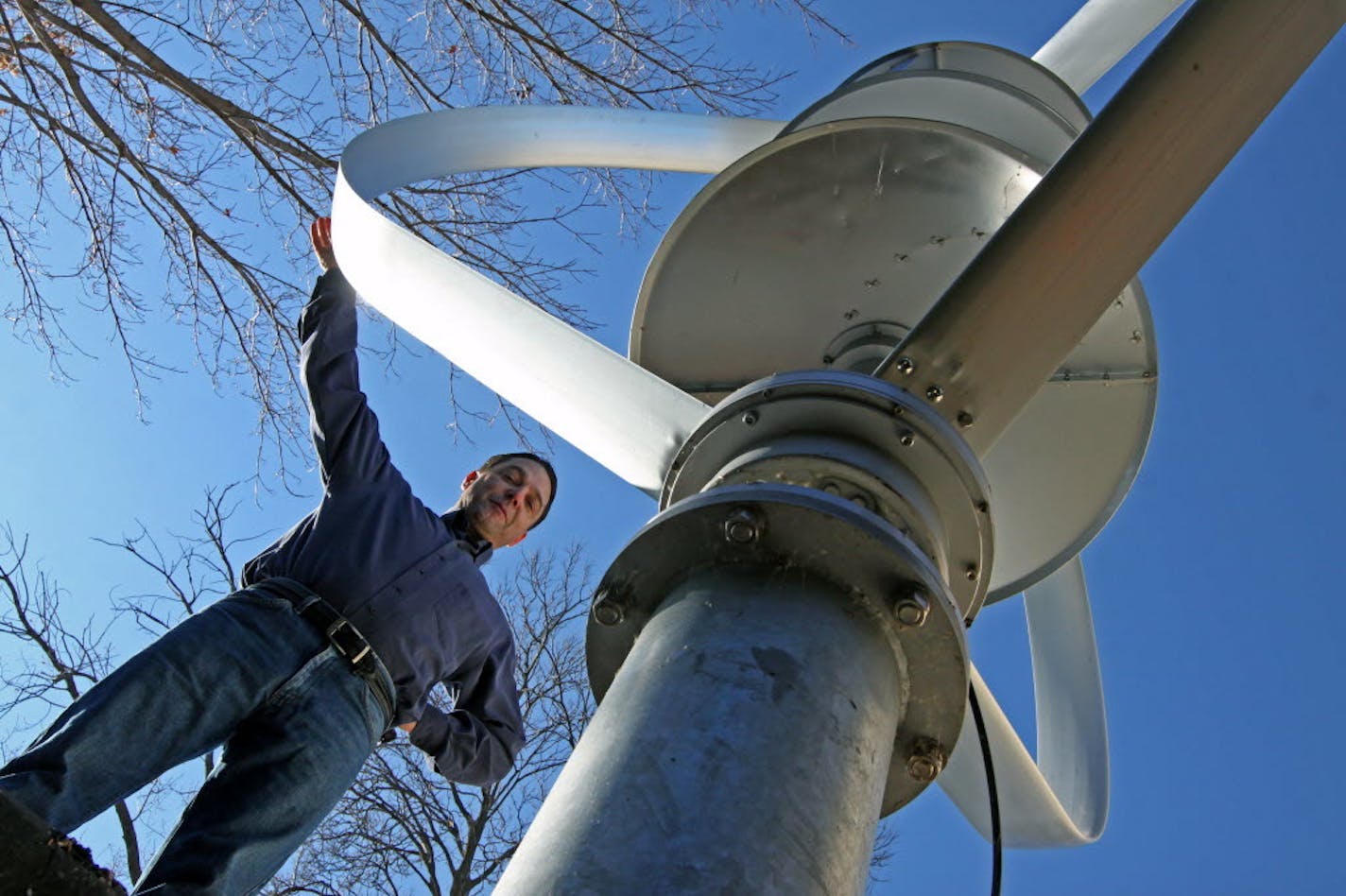 Jay Nygard has erected a wind turbine that resembles a huge egg beater at the rear of his house on Lake Minnetonka in Orono.