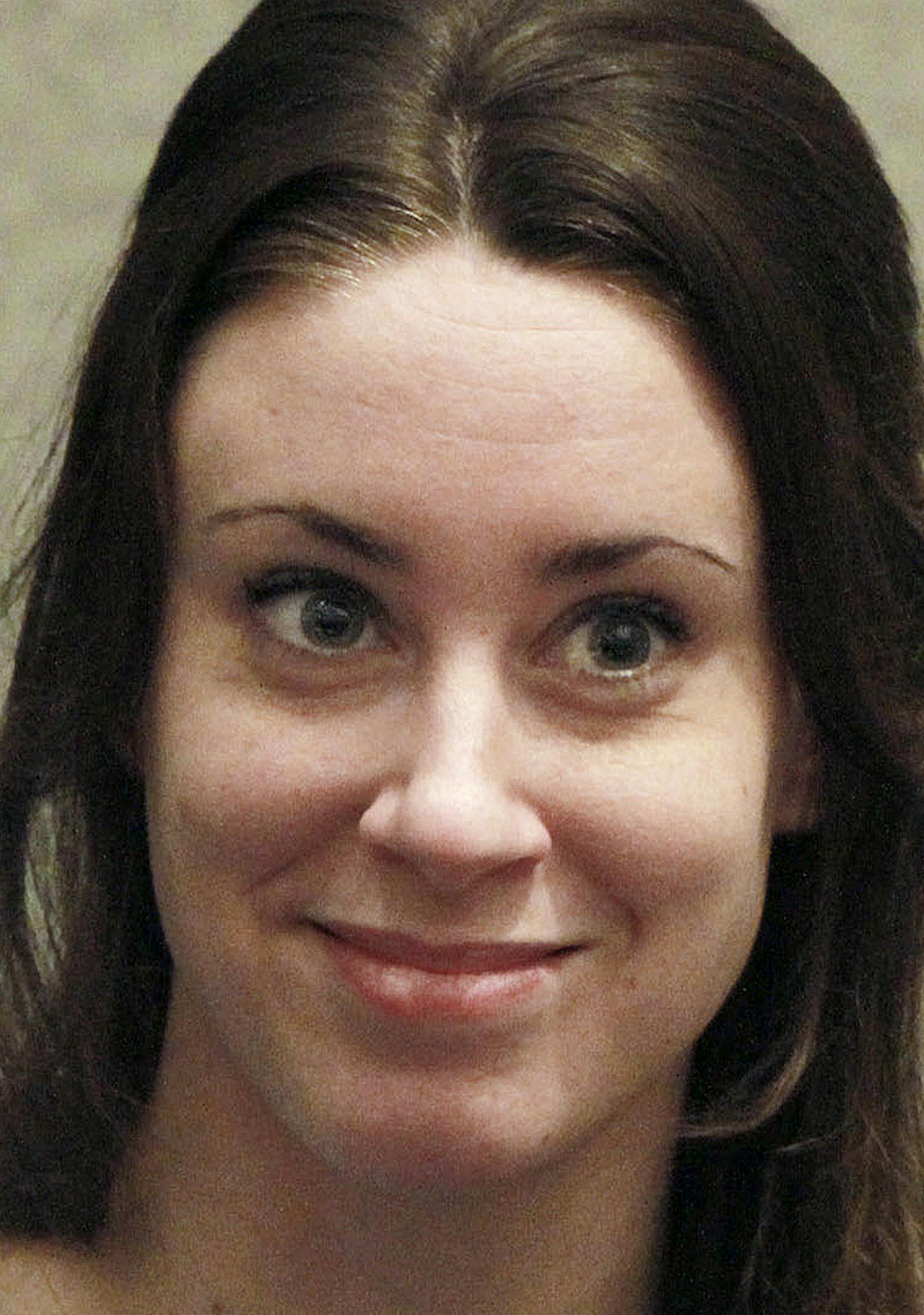 FILE - In this July 7, 2011 file photo, Casey Anthony smiles before the start of her sentencing hearing in Orlando, Fla. Florida authorities say Casey Anthony reported Wednesday Aug. 24, 2011 to begin her one-year probation for 2010 check-fraud convictions. (AP Photo/Joe Burbank, file)