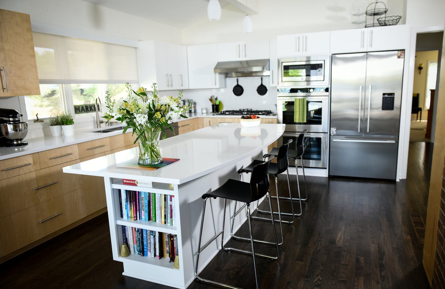 Rick and Jeanne Carter, above, recently remodeled the kitchen, top photo, of their split-level home on Lake Minnetonka, as part of a larger home-improvement project. Before the makeover, the kitchen had 1980s finishes.