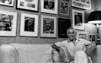 Johnny Carson, host of the "Tonight Show," sits in his front office under a wall covered with framed magazine covers bearing his picture in Los Angele