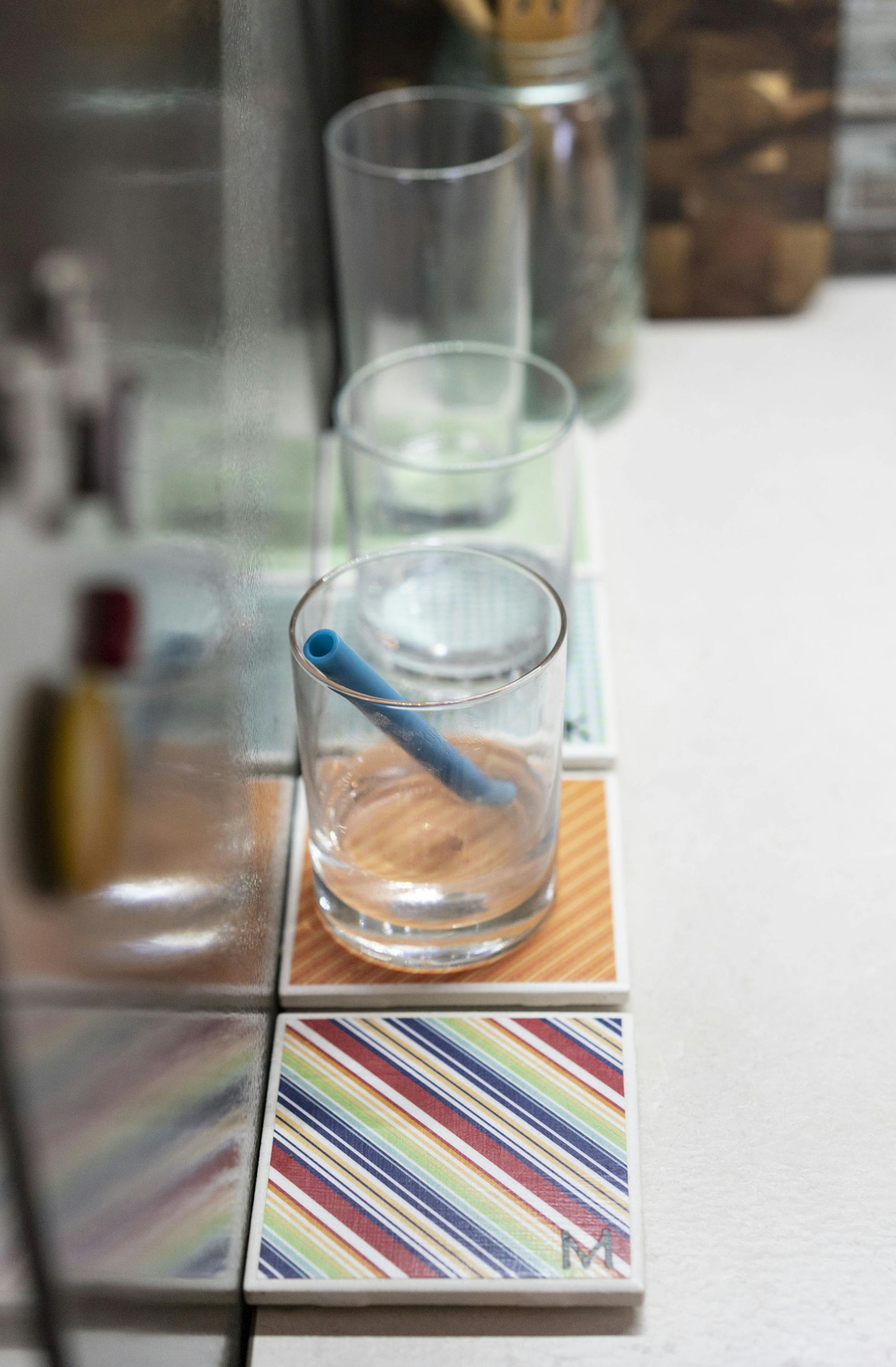 Each of Cronin's four children has an initialed coaster, right, for parking a drinking glass in the kitchen, so they don't have to reach for a new glass every time they're thirsty — to cut down on dishwashing.