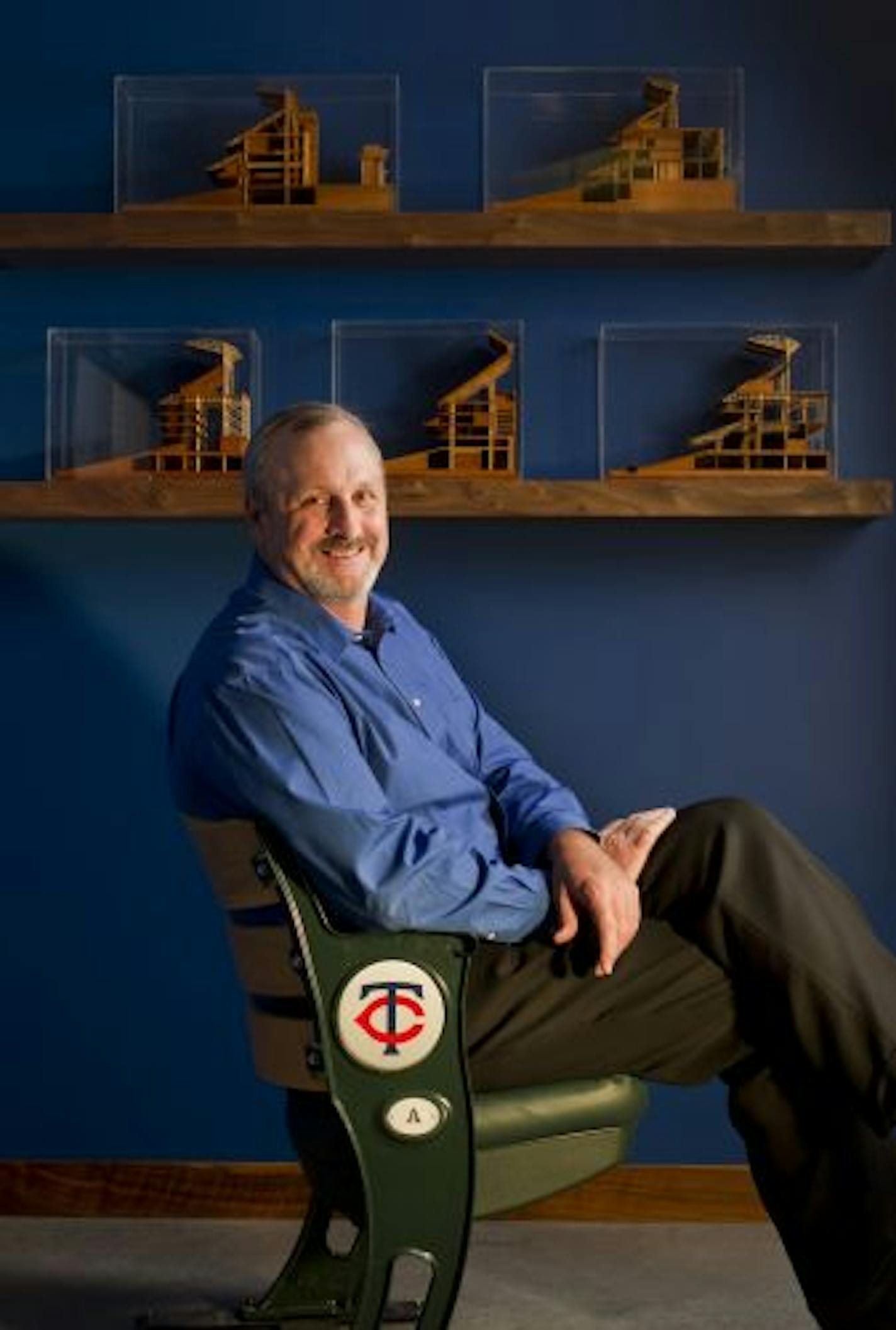 Earl Santee, senior principal at the sports architecture firm Populous, has a folding seat from Target Field in his Kansas City, Mo. office, where the world-renowed firm (formerly HOK Sport) designed Target Field in downtown Minneapolis, MN. DAVID EULITT/Special to the Minneapolis Star-Tribune