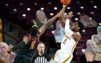 Minnesota’s Marcus Carr shoots over Maryland’s Darryl Morsell.