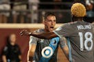 Minnesota United midfielder Ethan Finlay is congratulated by teammate Kevin Molino (18) after scoring in the first half against the Philadelphia Union