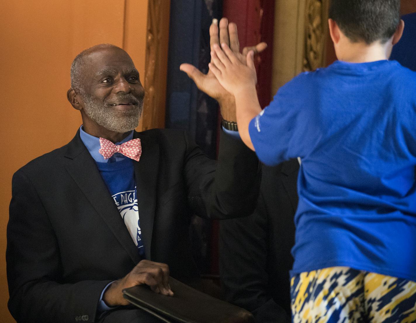 An elementary school named for Justice Alan Page is under construction in Maplewood. In this photo, Page high-fived students in 2017 at Justice Page Middle School in Minneapolis, which was renamed in his honor.