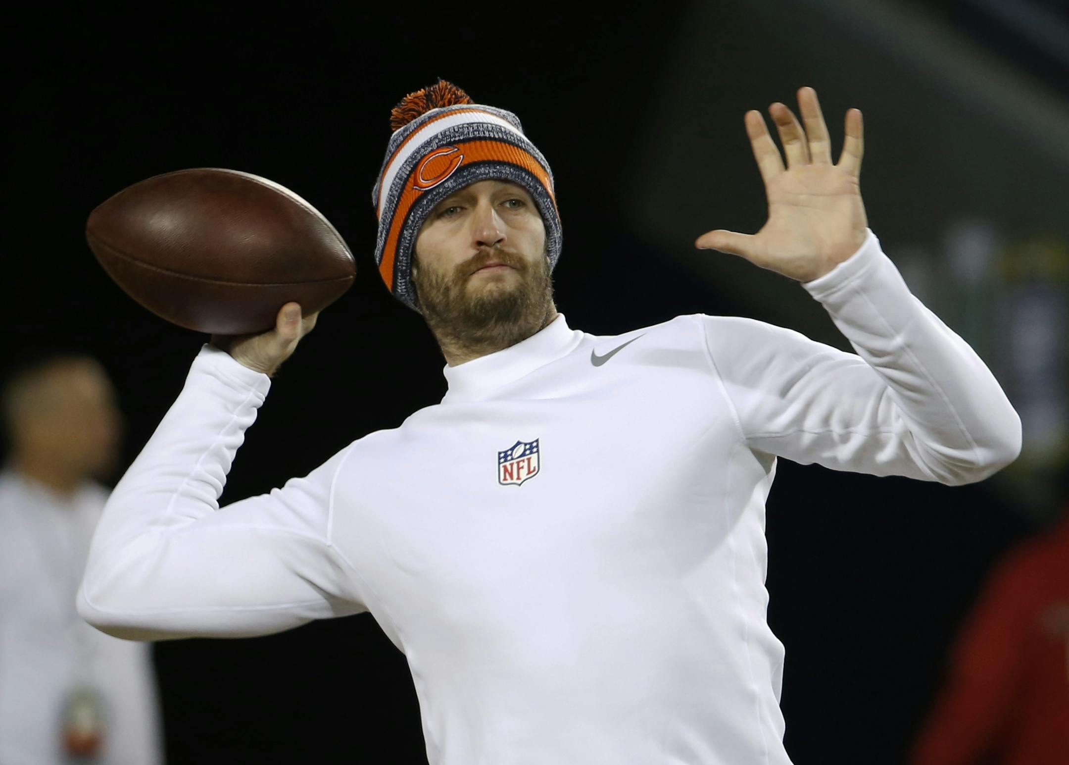 Chicago Bears quarterback Jay Cutler (6) warms up before an NFL football game against the Dallas Cowboys Thursday, Dec. 4, 2014, in Chicago. (AP Photo/Charles Rex Arbogast)