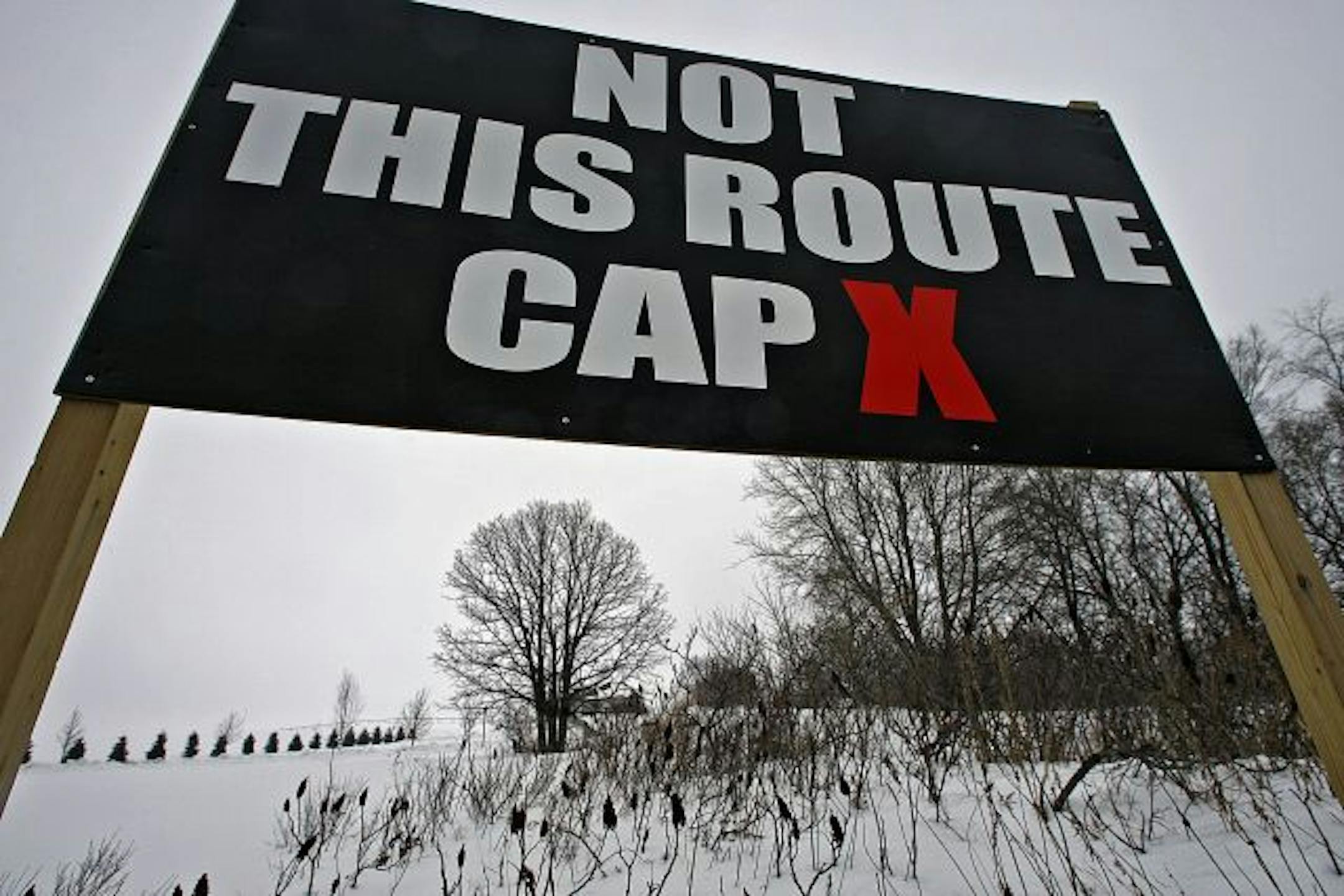 The proposed CapX2020 power project is comprised of about 600 miles of high-voltage power lines that will run along a route that includes a portion of rural Hampton, Minnesota. A portion of the line would run along Highway 50. One resident along the route have put up a sign to protest the project.