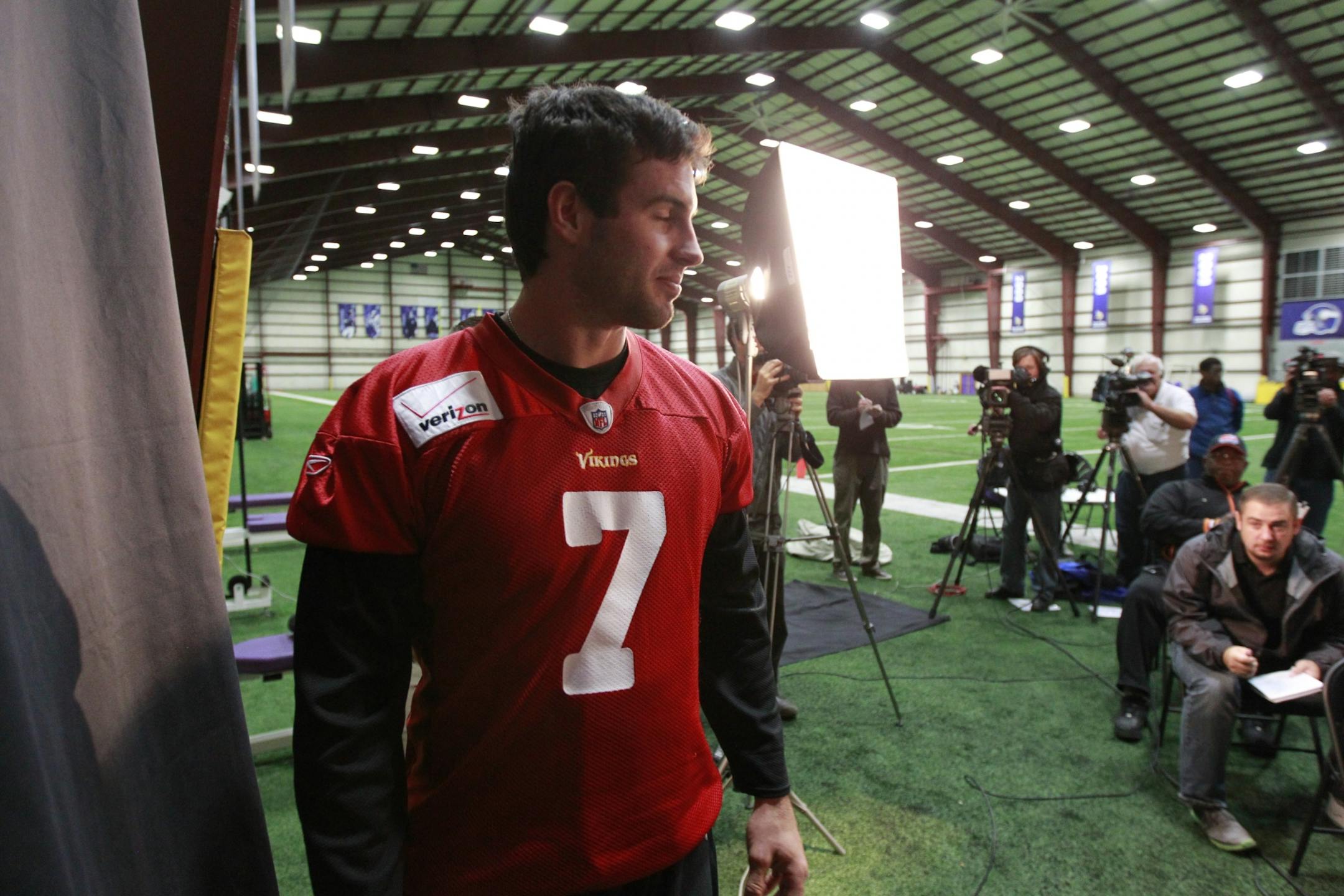 Vikings quarterback Christian Ponder walks into Wednesday's press conference at Winter Park.