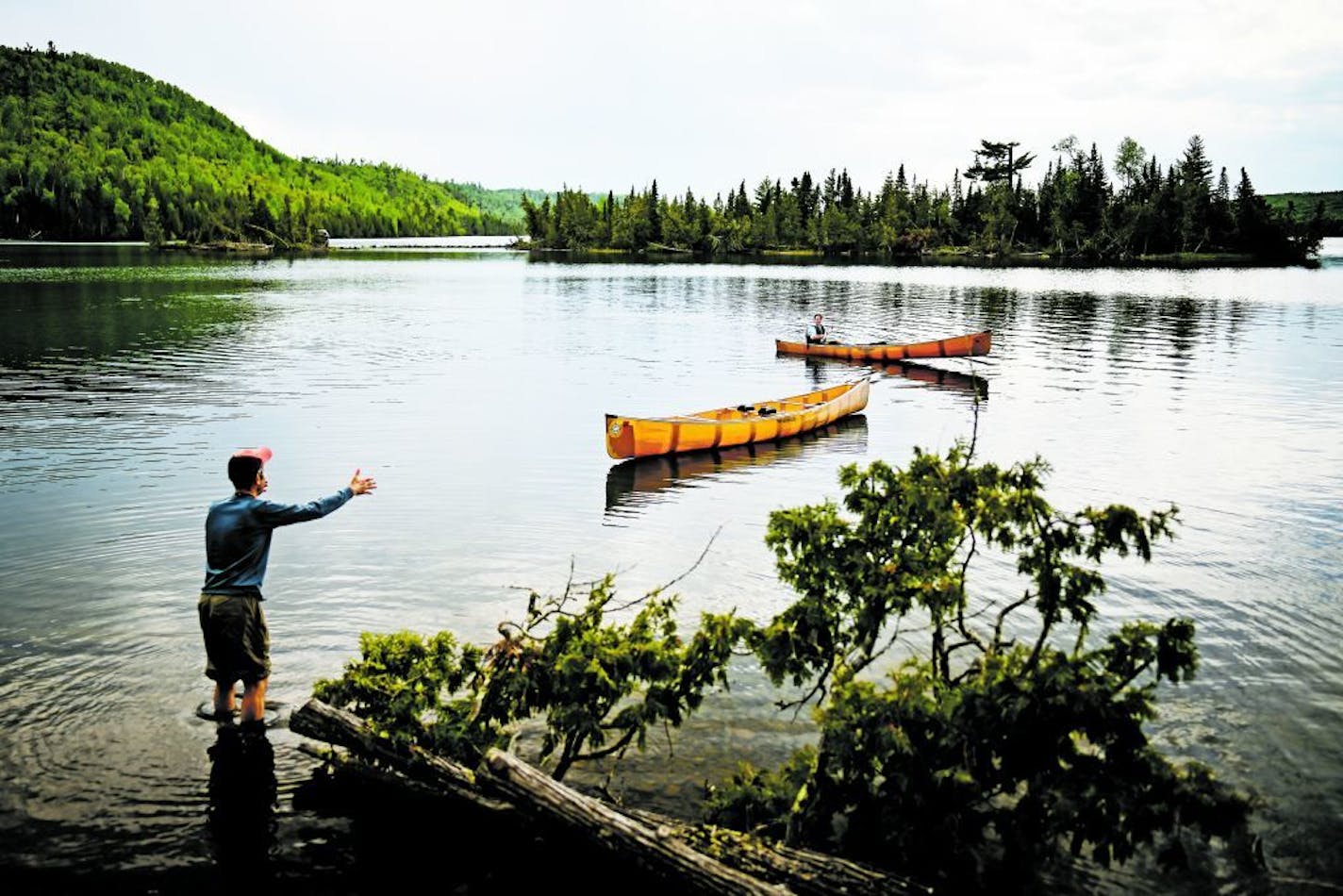 Bob Timmons, left, worked with Aidan Jones to retrieve a canoe that floated away from the campsite during the five-day trip in the BWCA.