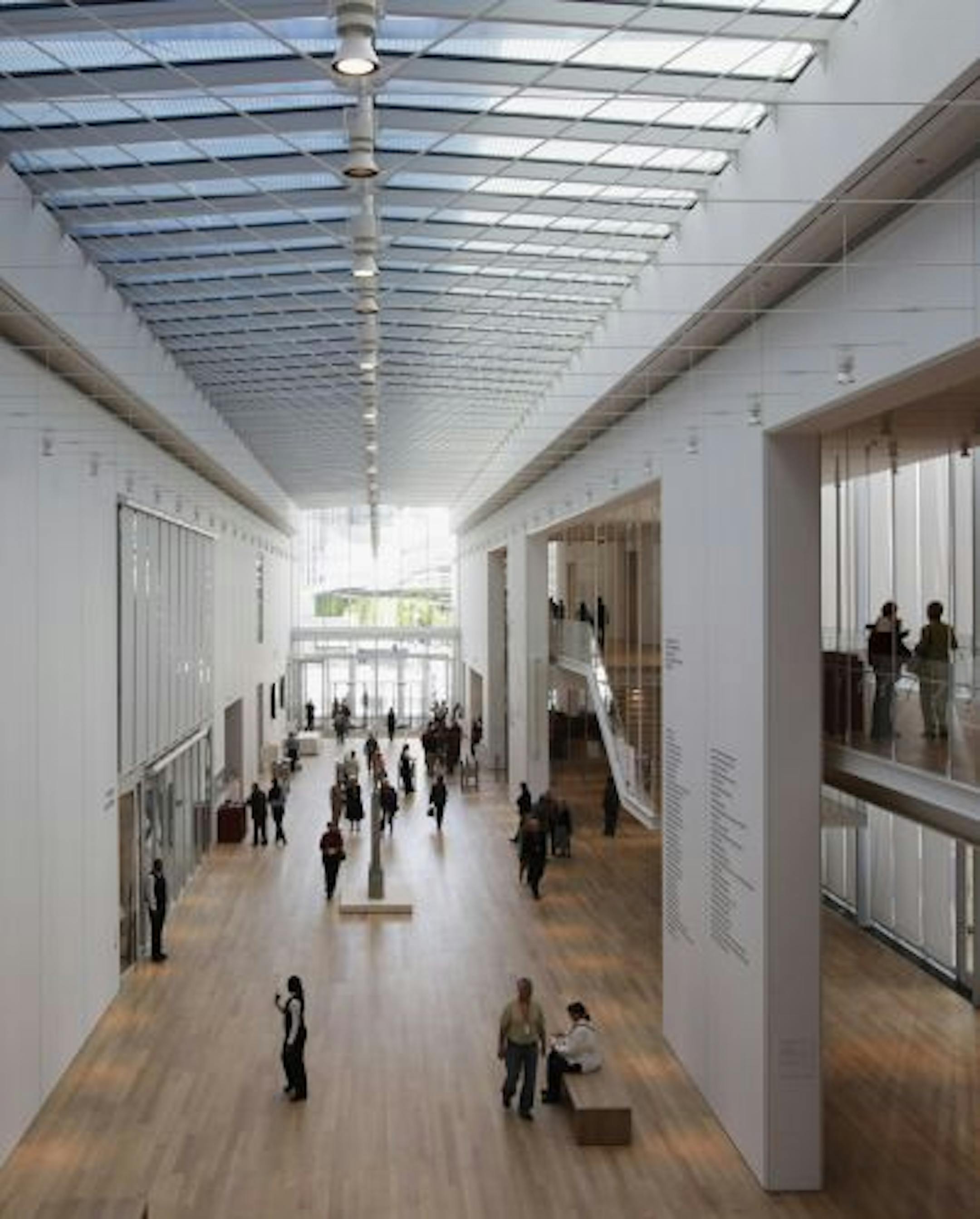 Members of the Art Institute of Chicago walk through the main hallway at the museum's new Modern Wing by Architect Renzo Piano on Thursday, May 14, 2009. In a single stroke, the 264,000-square-foot wing turns Chicago's art museum into the nation's second-largest and opens up the previously windowless fortress of culture to the sky and the city. The new Modern Wing opens to the public on Saturday, May 16.