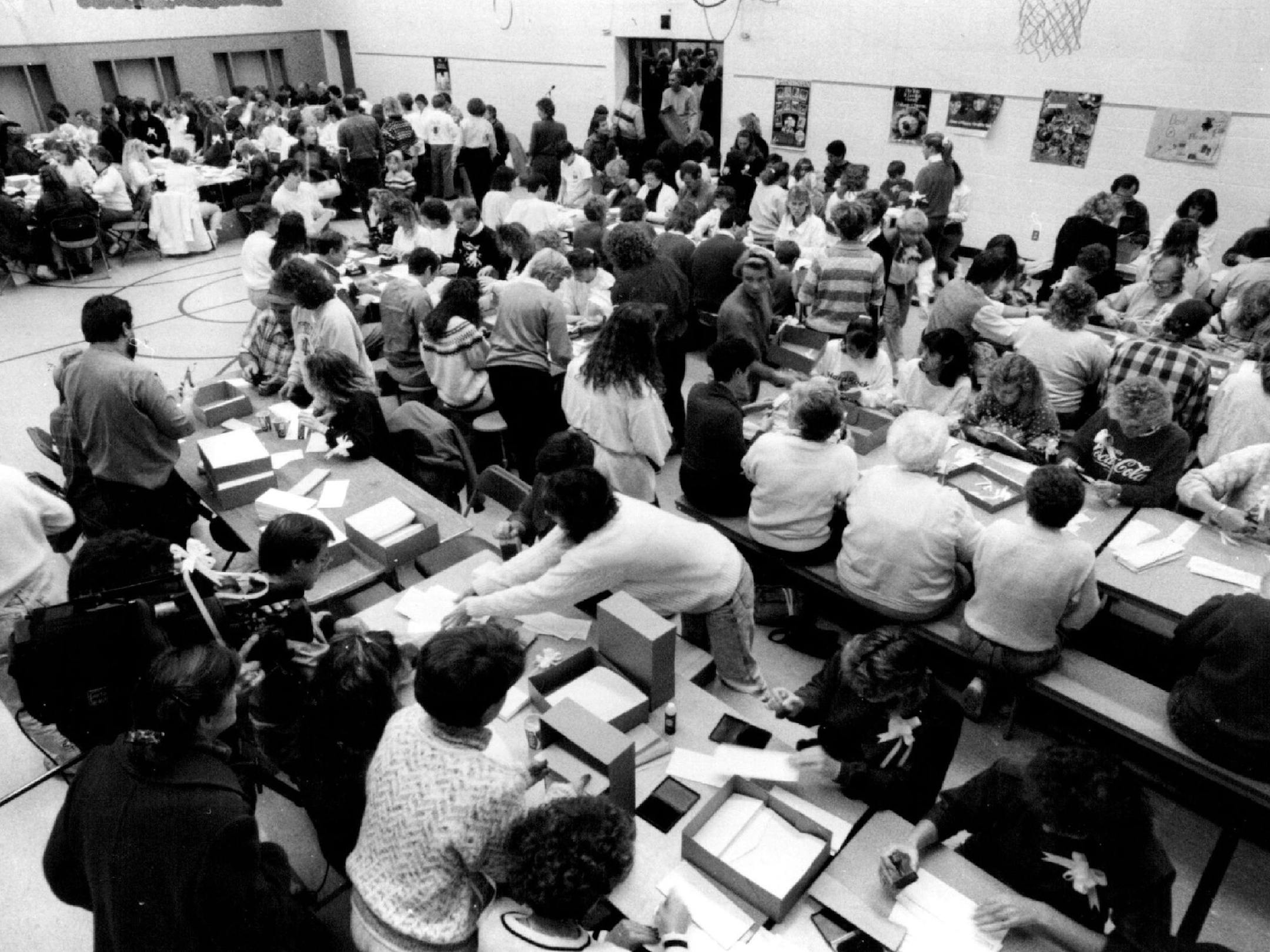 November 2, 1989 Some 500 plus men, woman, and children addressed letters for a mass mailing in the gym of Kennedy Elementary School. The photo shows the cafeteria side of the gym. Through the door in the background is another room as large as the one in the picture. November 3, 1989 More than 500 volunteers prepared a mass mailing Thursday night in the kidnapping of Jacob Wetterling. Regene Radniecki, Minneapolis Star Tribune