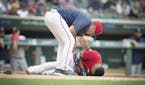Twins Manager Paul Molitor ran out to check on Eduardo Escobar after he was hit by Red Sox pitcher Rick Porcello during the first inning as the Twins 