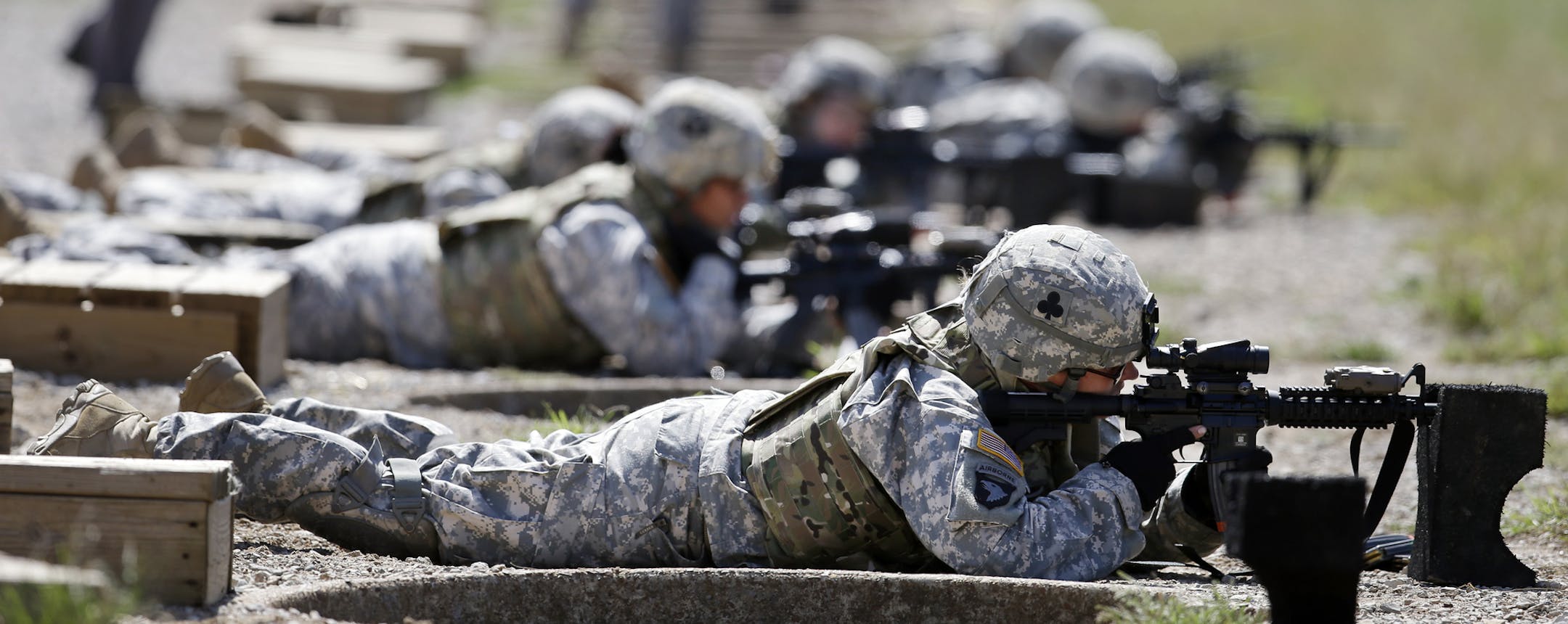 FILE - This Sept. 18, 2012 file photo shows female soldiers training on a firing range while wearing new body armor in Fort Campbell, Ky. Only a small fraction of Army women say theyíd like to move into one of the newly opening combat jobs, but those few who do, say they want a job that takes them right into the heart of battle, according to preliminary results from a survey of the serviceís nearly 170,000 women. (AP Photo/Mark Humphrey, File)