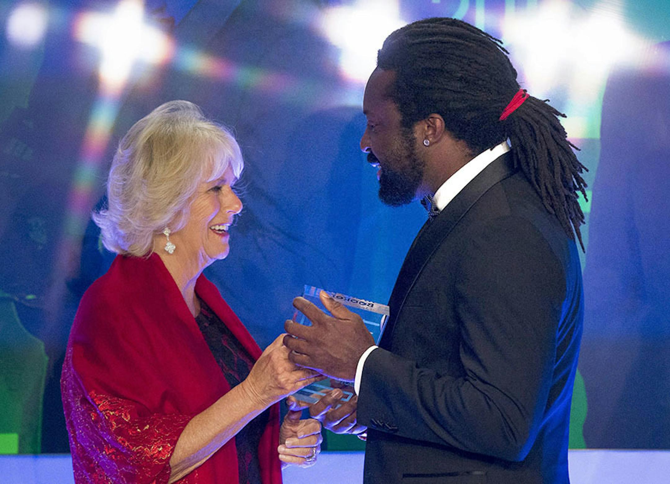 Britain's Camilla, Duchess of Cornwall presents the trophy to Marlon James, author of "A Brief History of Severn Killings", after he was named as the winner of the Man Booker Prize for Fiction 2015, in London, Tuesday Oct. 13, 2015. Marlon James became the first Jamaican winner of the prestigious Booker Prize for fiction Tuesday with a vivid, violent, exuberant and expletive-laden novel based on the 1976 attempted assassination of Bob Marley.