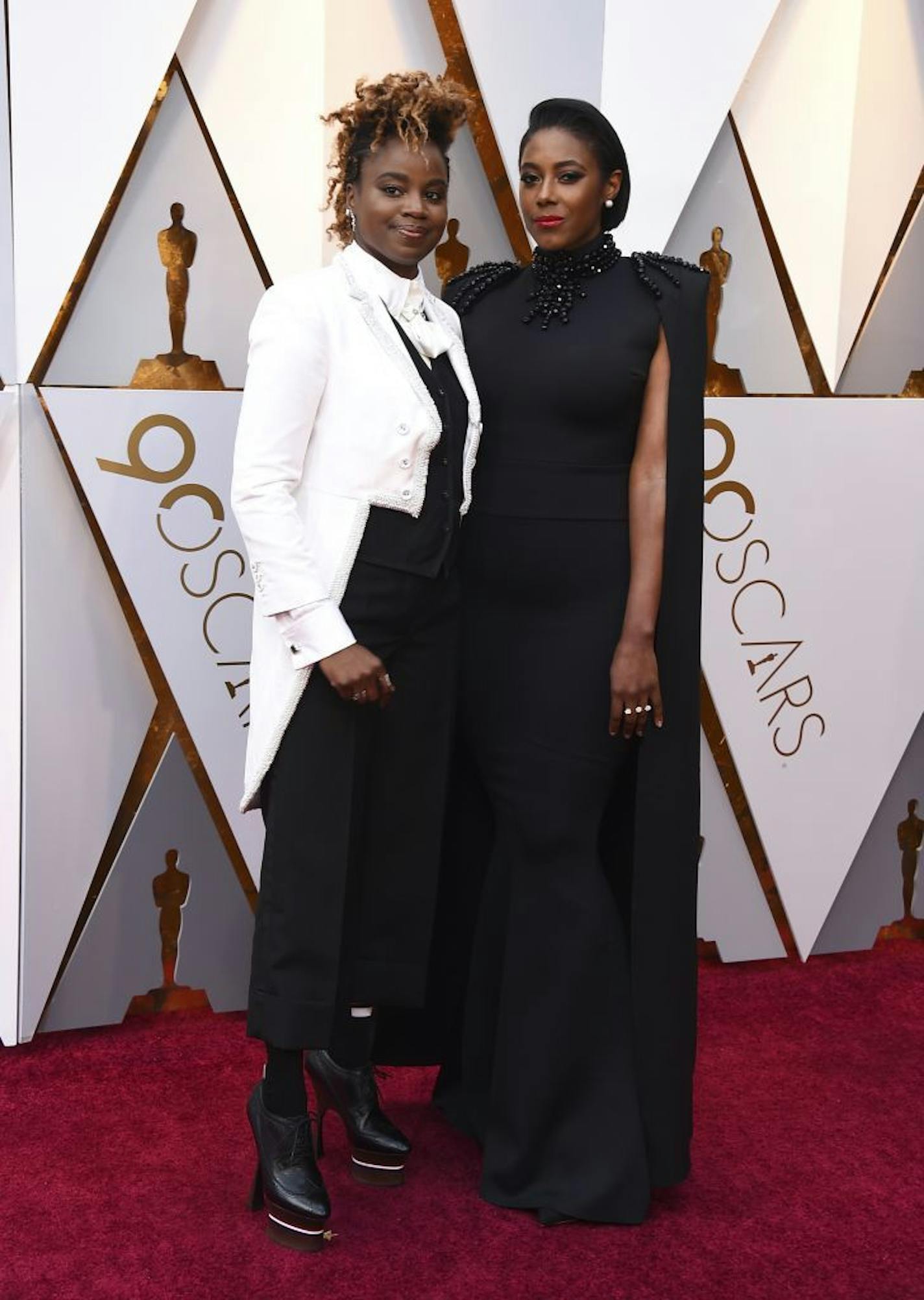 Dee Rees, left, and Sarah M. Broom arrive at the Oscars on Sunday, March 4, 2018, at the Dolby Theatre in Los Angeles.