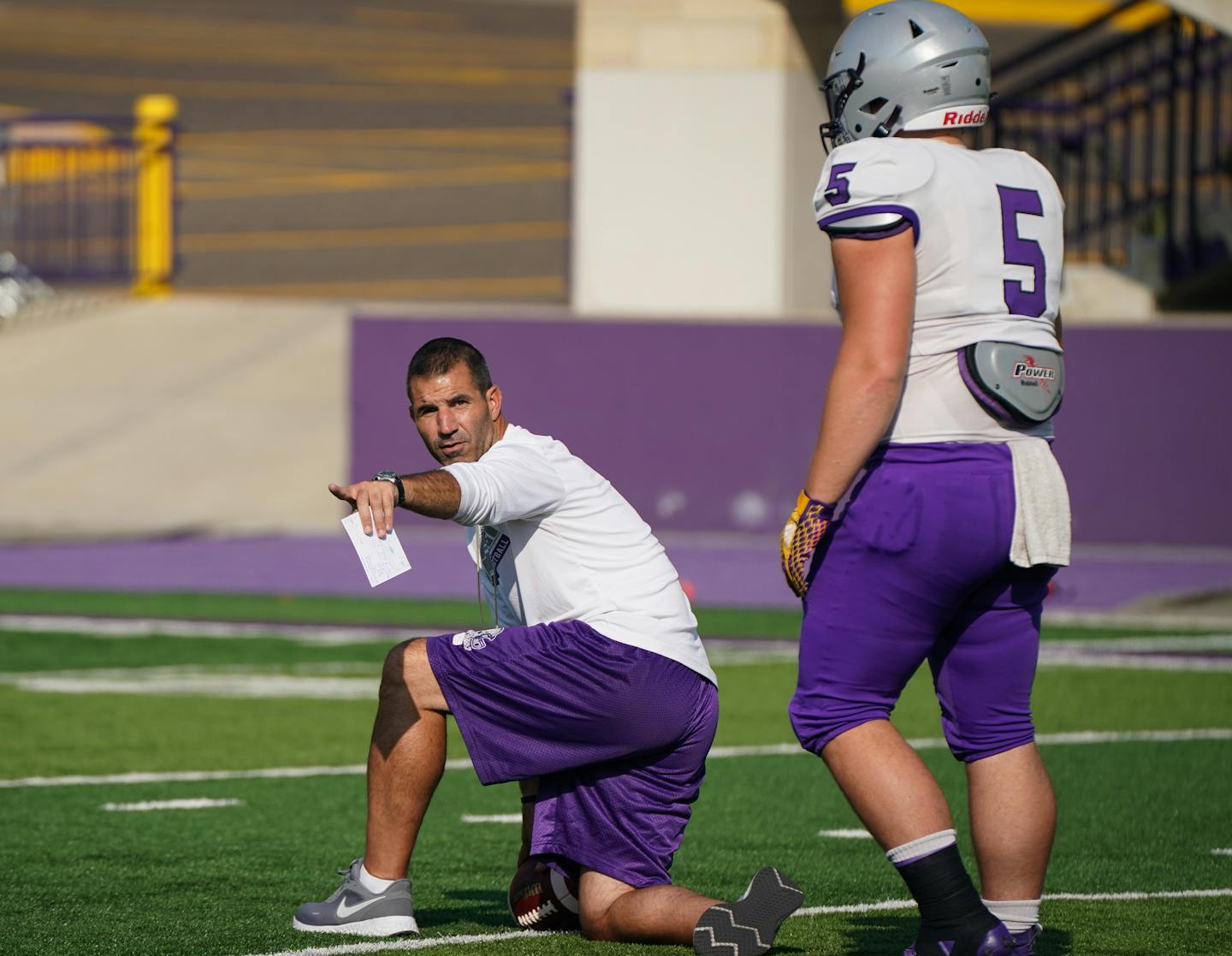 Glenn Caruso is the 29th head coach in the 114-year history of University of St. Thomas football. Caruso gave direction to running back Joshua Komis.