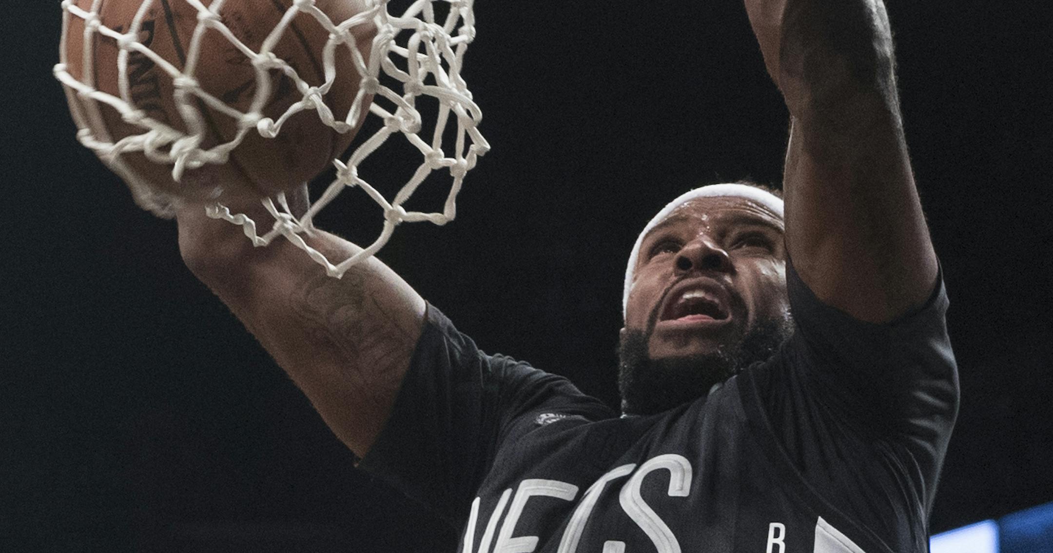 Brooklyn Nets forward Trevor Booker dunks during the second half of the team's NBA basketball game against the Indiana Pacers, Friday, Oct. 28, 2016, in New York. The Nets won 103-94. (AP Photo/Mary Altaffer)
