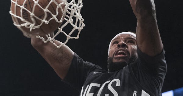 Brooklyn Nets forward Trevor Booker dunks during the second half of the team's NBA basketball game against the Indiana Pacers, Friday, Oct. 28, 2016, 