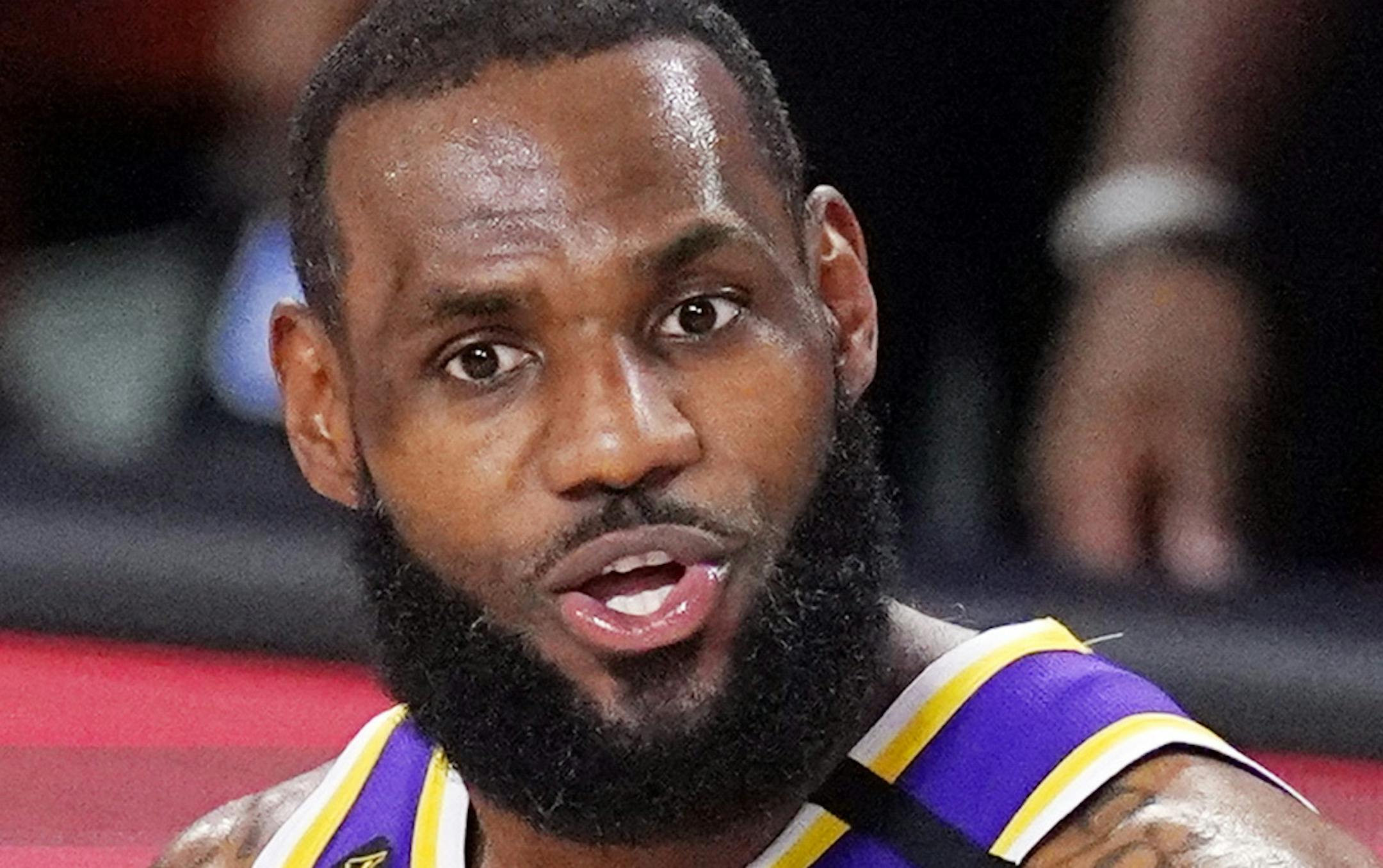 Los Angeles Lakers' LeBron James (23) has words with teammate Kentavious Caldwell-Pope (1) during the second half of an NBA conference final playoff basketball game against the Denver Nuggets Saturday, Sept. 26, 2020, in Lake Buena Vista, Fla. (AP Photo/Mark J. Terrill)