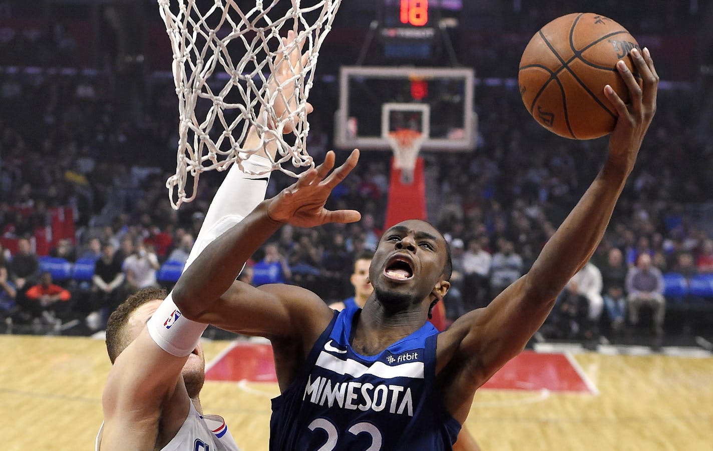 Minnesota Timberwolves forward Andrew Wiggins, right, shoots as Los Angeles Clippers forward Blake Griffin defends during the first half of an NBA basketball game, Monday, Jan. 22, 2018, in Los Angeles. (AP Photo/Mark J. Terrill)