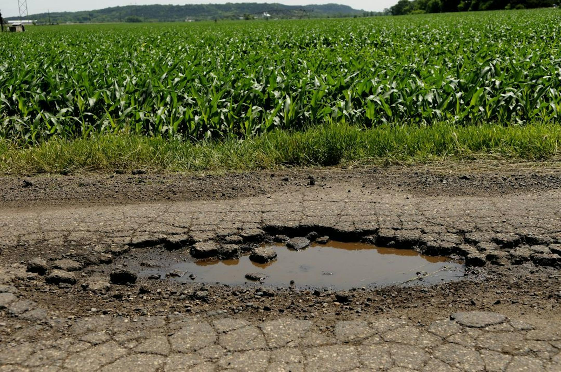 A road crew from Otte Excavating worked patching Harry Road.The Randolph Township supervisors in southern Dakota County have a problem. It�s Harry. Harry Road, the main entry to Lake Byllesby Regional Park, faces a dilemma that may spread to other rural areas with shrinking state transportation funding: Annual repairs that are too expensive for small town taxpayers to bear, state officials say. Township supervisors this month made an offer they hope the county board won�t refuse. This pothole wa