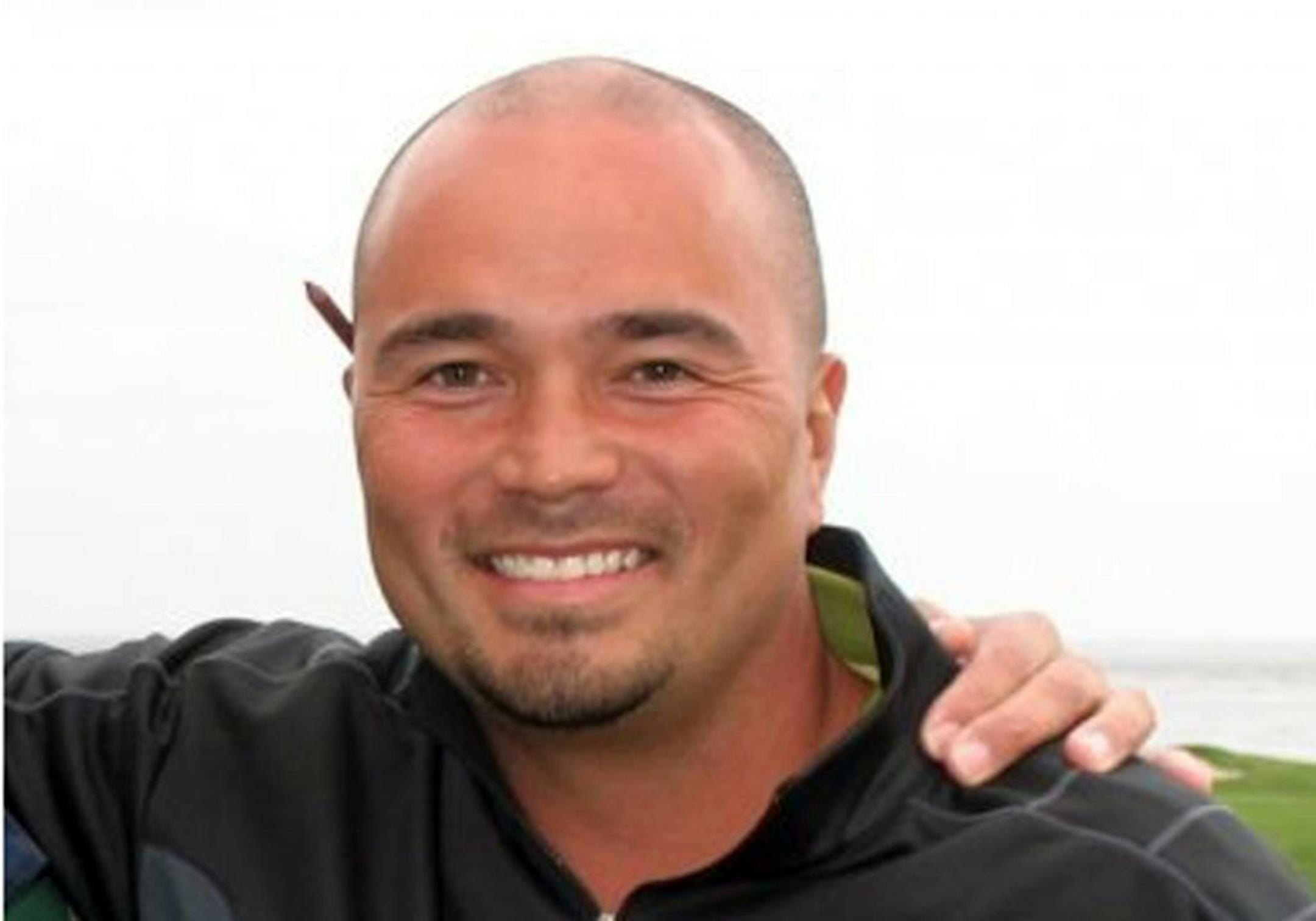 This undated photo provided by Golfmanna shows golfer Mark Mihal who fell into a sinkhole that opened up under him on the 14th hole of a golf course in Waterloo, Ill. Mihal was hoisted out safely with a rope after falling 18 feet into the 10-foot-wide pit and suffered a dislocated shoulder.