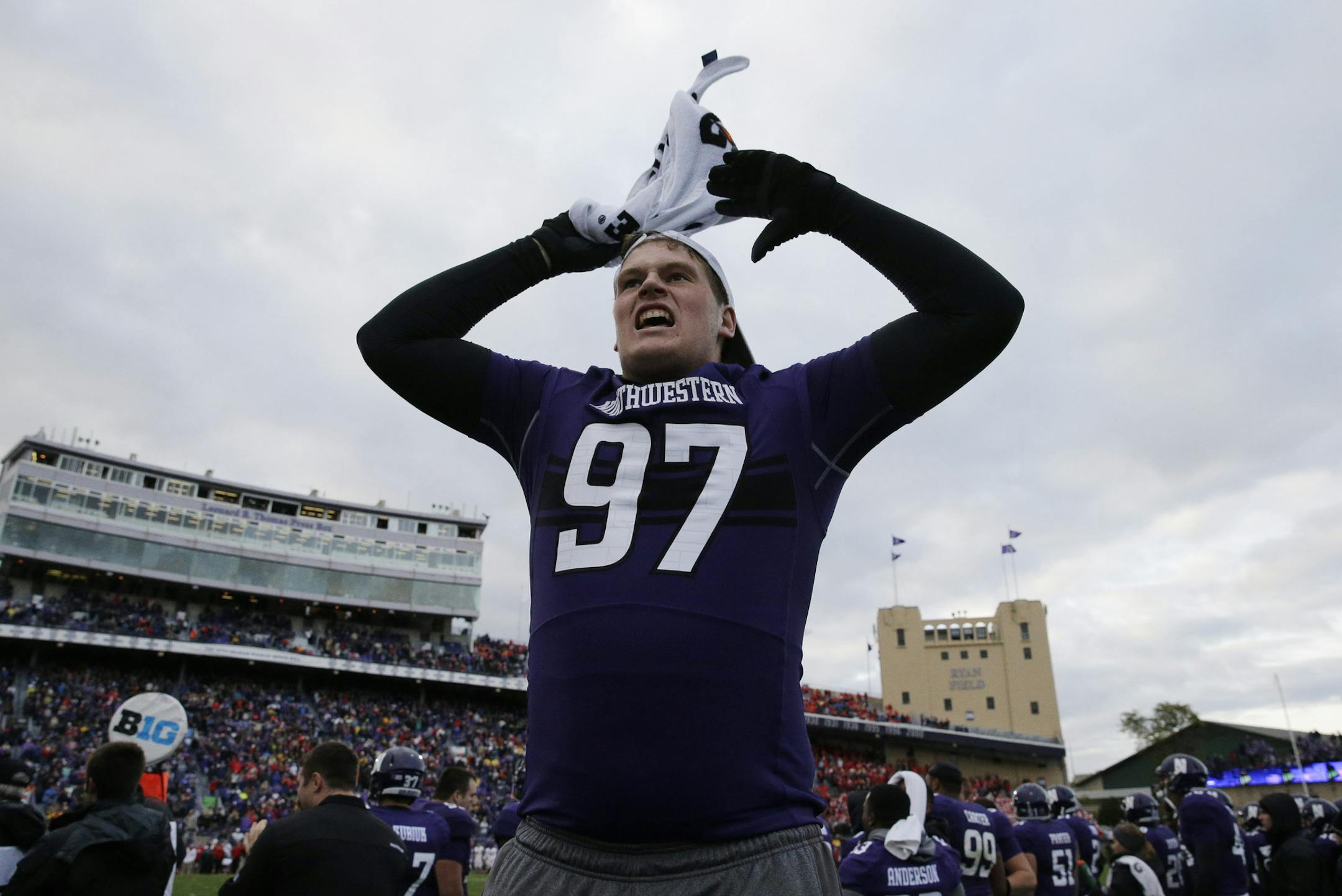 Northwestern defensive lineman Ben Oxley cheered for his team during the second half against Wisconsin in Evanston, Ill., on Saturday. Northwestern won 20-14.