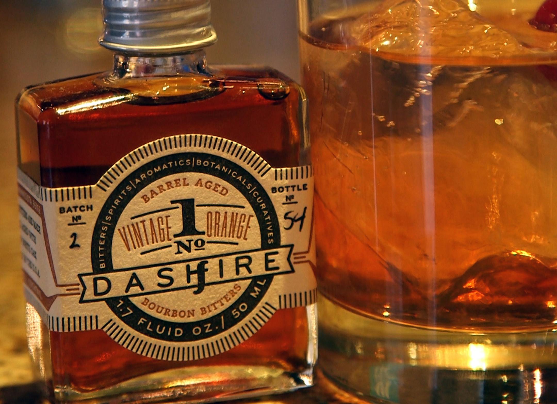 Bartender Robert Jones at Saffron demonstrates drinks made with bitters. ] still frame from video