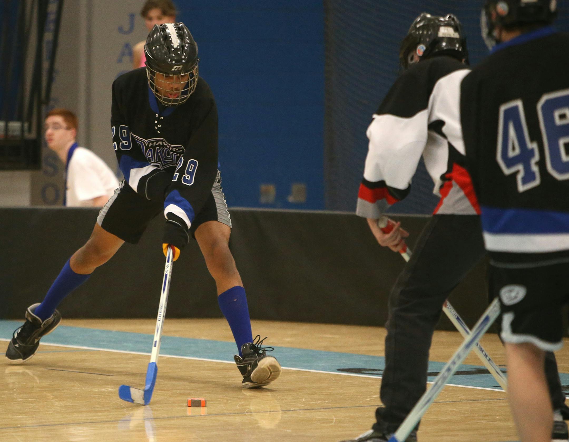 Dakota United won 4-2 over North Suburban during the adapted floor hockey CI championships at Bloomington Jefferson High Saturday, March 14, 2015, in Bloomington, MN. Here, Dakota United's Kennard Lyles takes a shot during the first period.