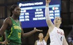Senegal center Oumou Toure (13) looks toward the referee as United States guard Lindsay Whalen signals a basket during the second half of a women's ba