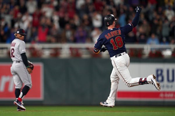 Minnesota Twins catcher Mitch Garver (18) celebrated after hitting a three run home run in the seventh inning.