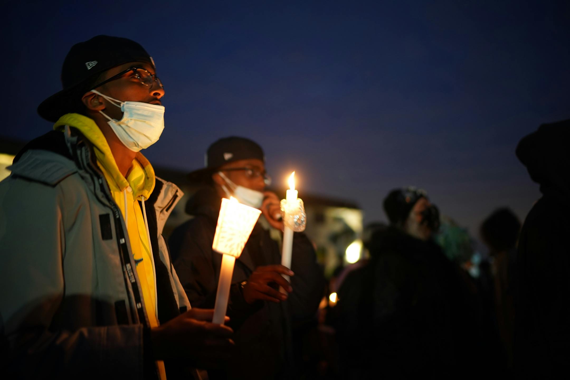 Demonstrators, many with candles, chanted across the street. Demonstrators gathered for a protest near the Brooklyn Center Police Department on Thursday, April 15, 2021 in response to the fatal police shooting of Daunte Wright in Brooklyn Center, Minn.