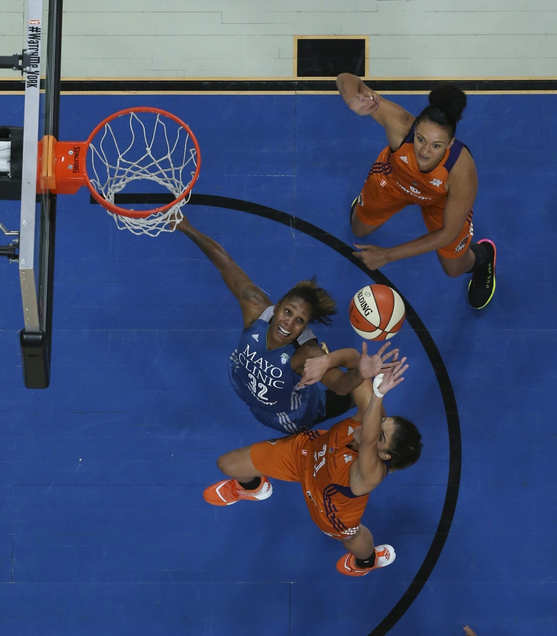 Minnesota Lynx forward Rebekkah Brunson (32) and Phoenix Mercury guard Marta Xargay (21) fought for a Lynx rebound.