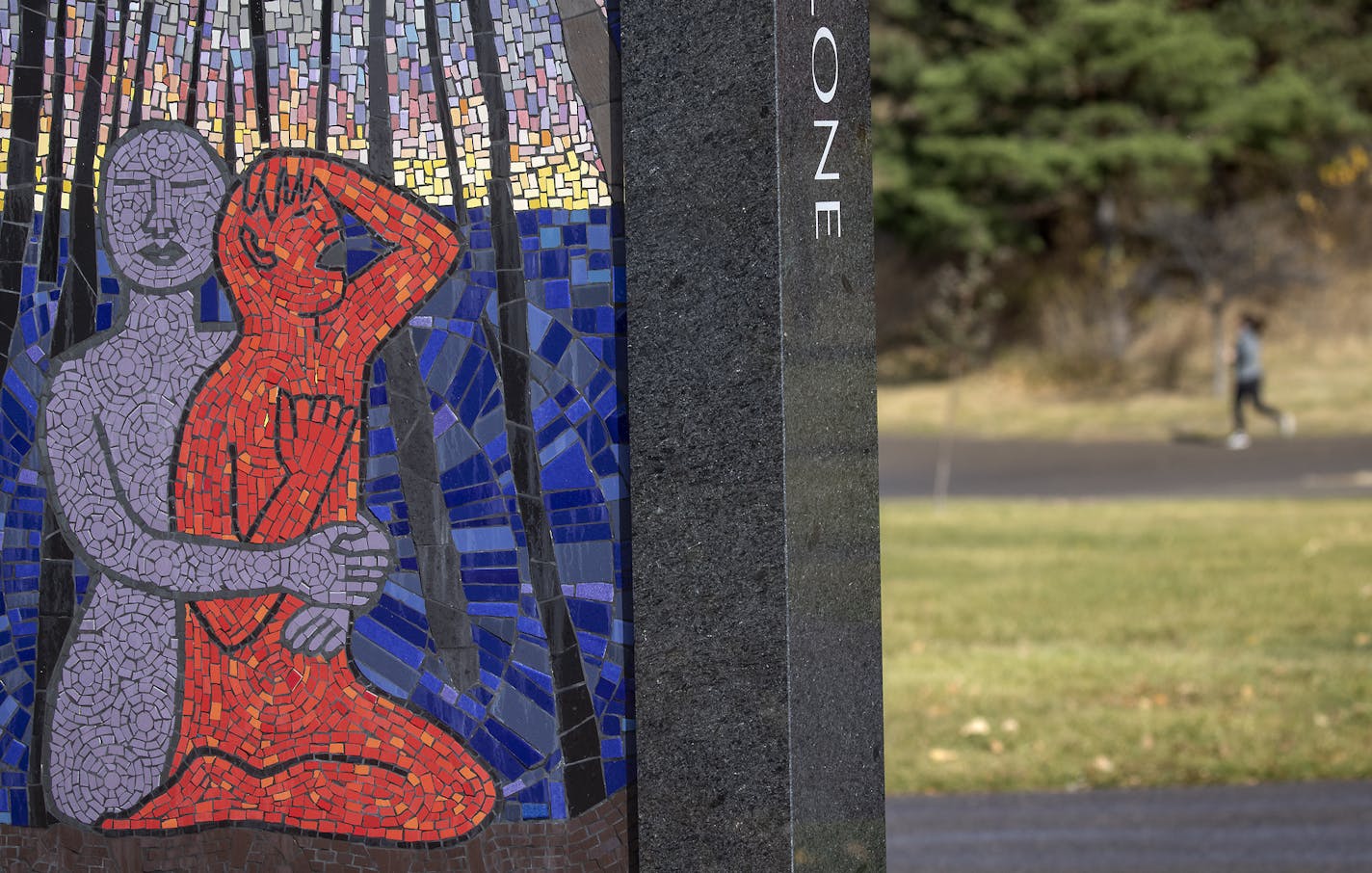 A runner ran by the nation's first memorial to survivors of sexual violence located at Boom Island Park, Friday, October 16, 2020 in Minneapolis, MN. ] ELIZABETH FLORES • liz.flores@startribune.com