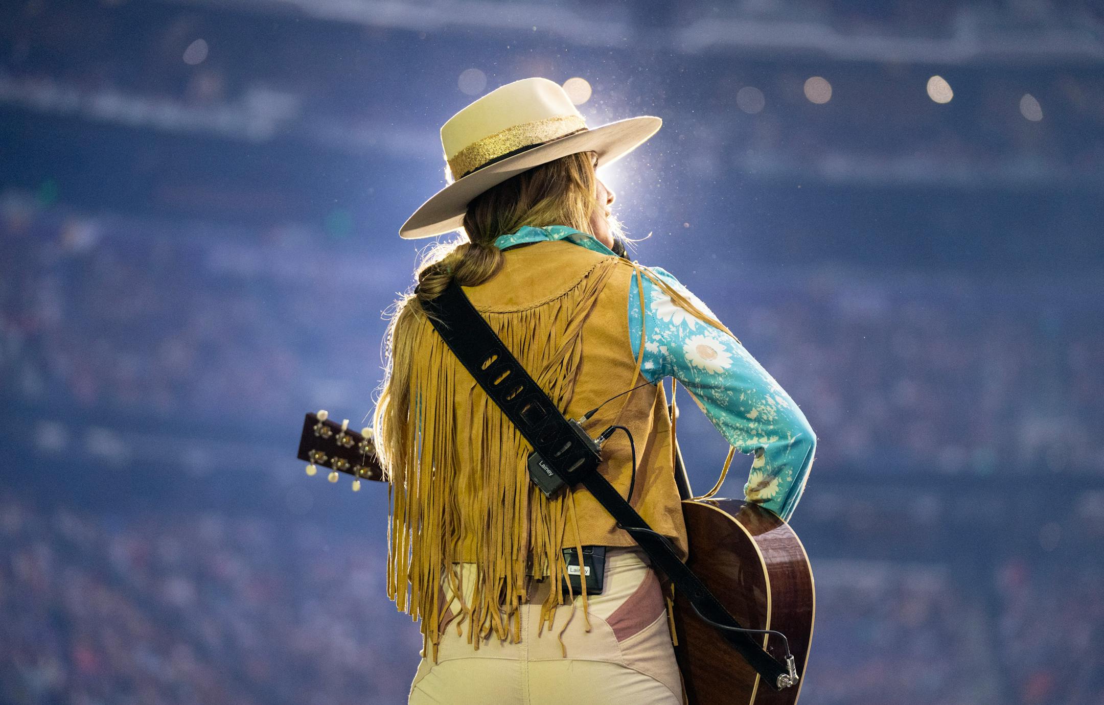 Lainey Wilson opened for Luke Combs at U.S. Bank Stadium.
