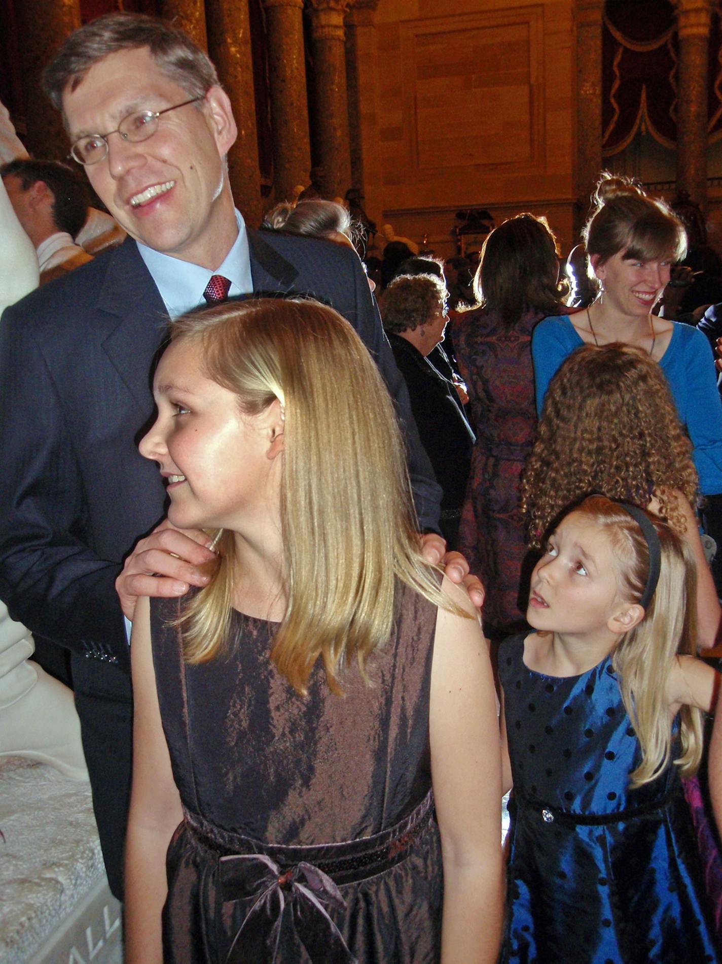 Rep. Erik Paulsen, R-Minn., was accepting good wishes Tuesday, shortly after being sworn in at the U.S. Capitol. In the foreground at left is daughter Briana, 13, with daughter Liesl, 7, at right.