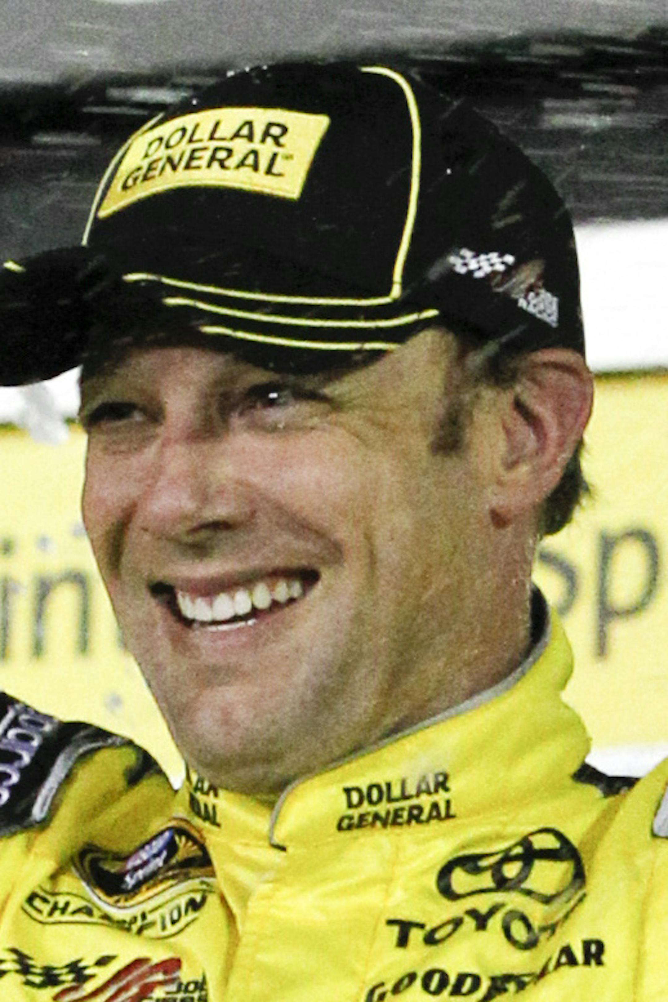 Matt Kenseth celebrates in Victory Lane with his crew after winning the NASCAR Sprint Unlimited auto race at Daytona International Speedway, Saturday, Feb. 14, 2015, in Daytona Beach, Fla. (AP Photo/Terry Renna)