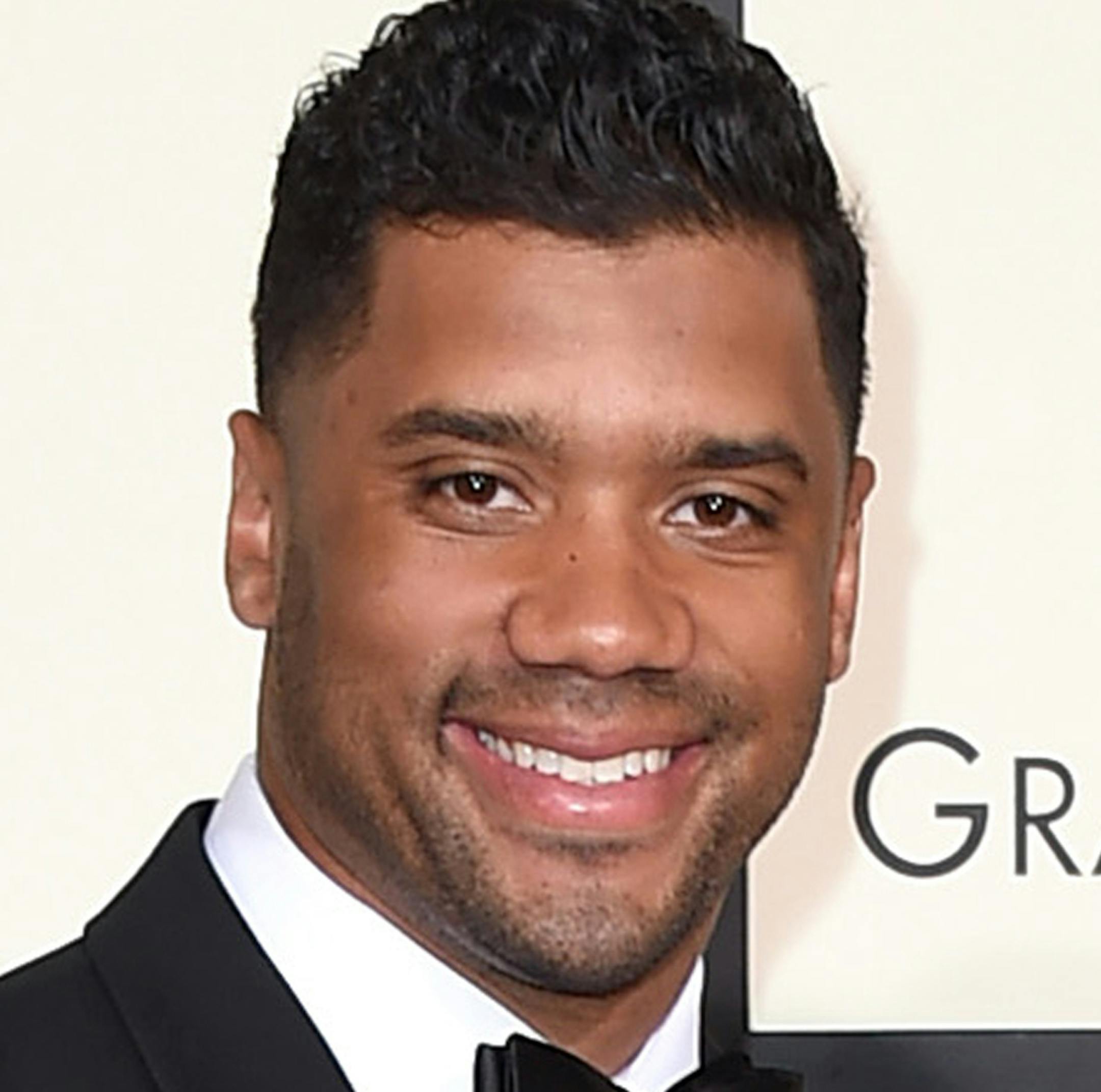 FILE - In this Feb. 15, 2016 file photo, Seattle Seahawks football player Russell Wilson, left, and singer Ciara arrive at the 58th annual Grammy Awards in Los Angeles. The couple were married Wednesday, July 6, 2016, at Peckforton Castle in Cheshire, England. (Photo by Jordan Strauss/Invision/AP, File)
